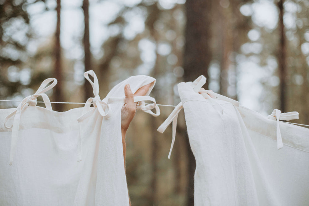 Linen curtains and home textiles styled in a winter outdoor setting