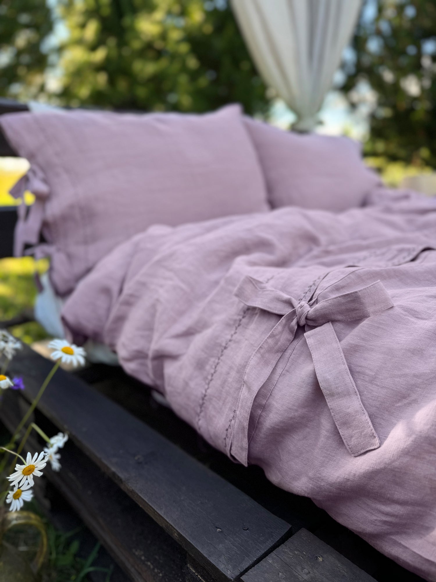 Black embroidered linen duvet cover close-up, contrast embroidery detail