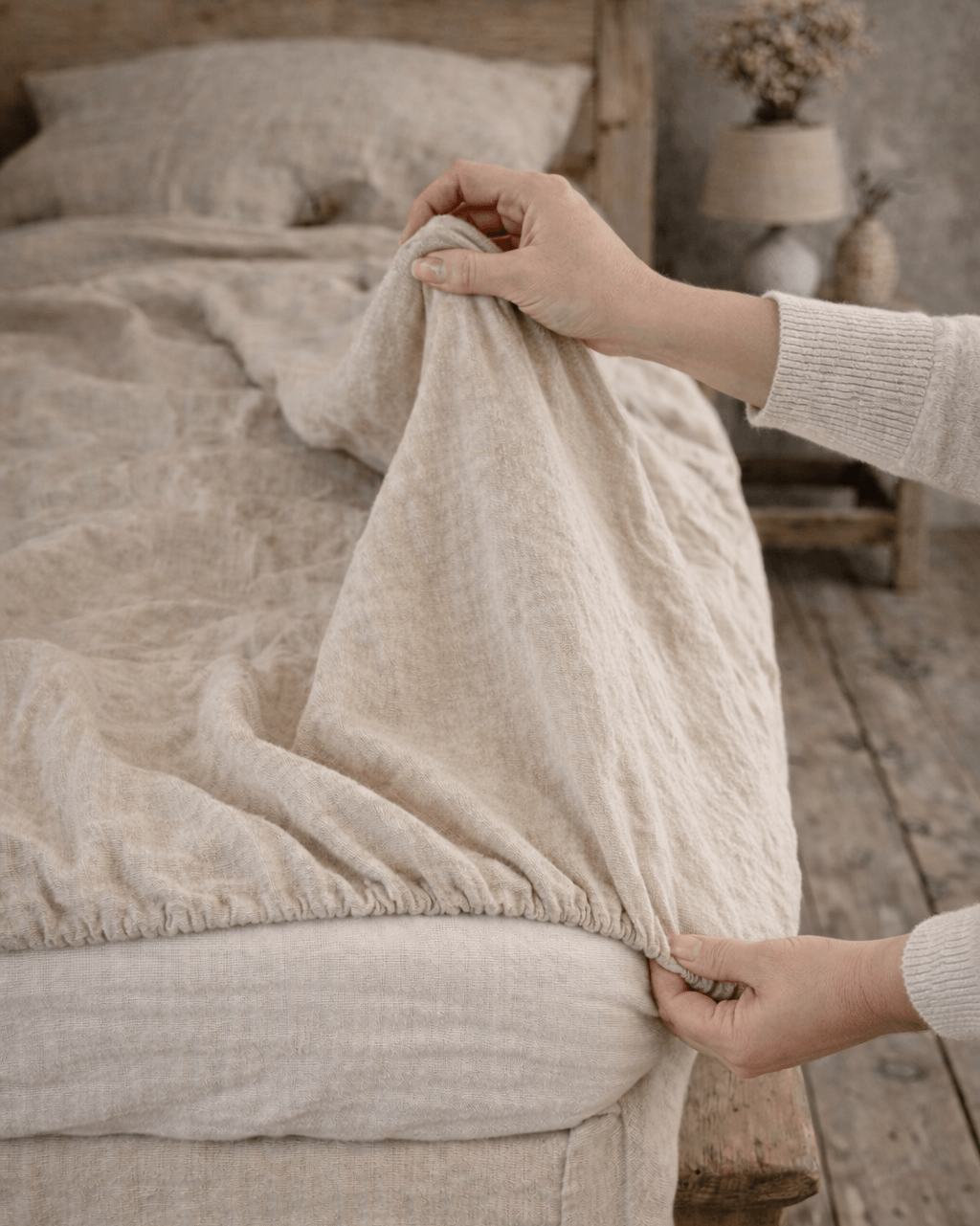 Linen fitted sheet folded, showing seamless softened linen texture