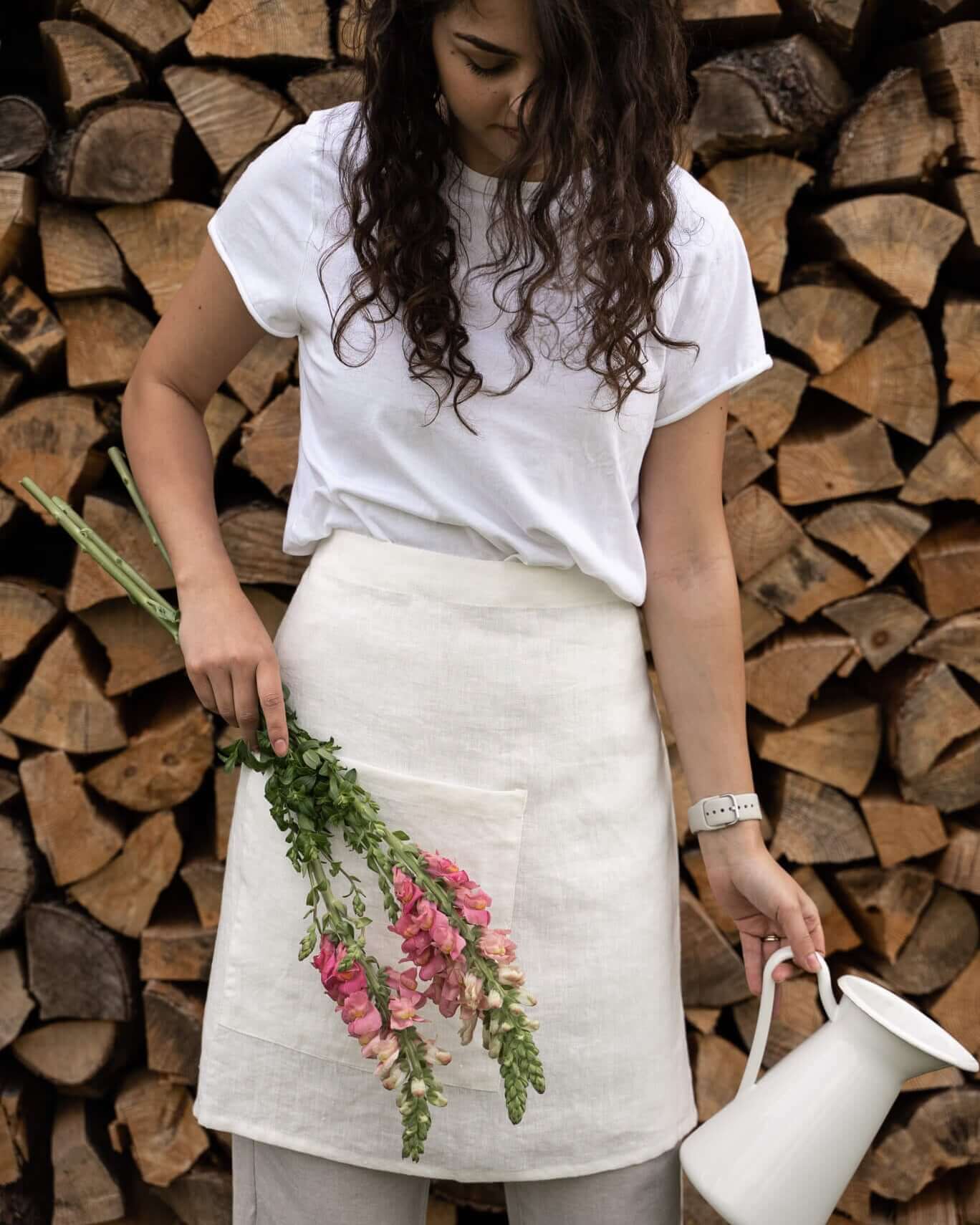 Woman wearing linen half apron while cooking, lifestyle photo