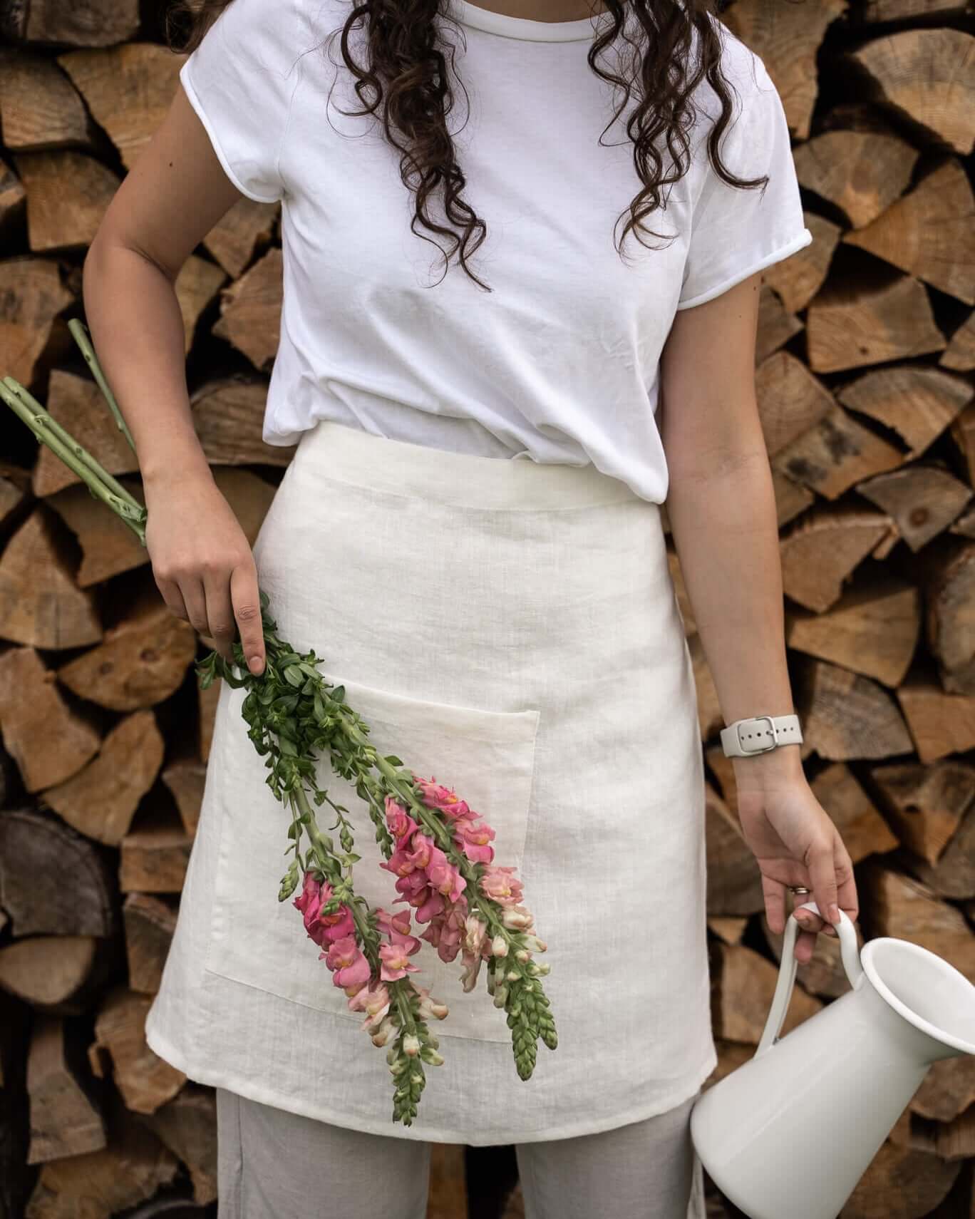 Linen half apron in natural color, front view, waist tie detail