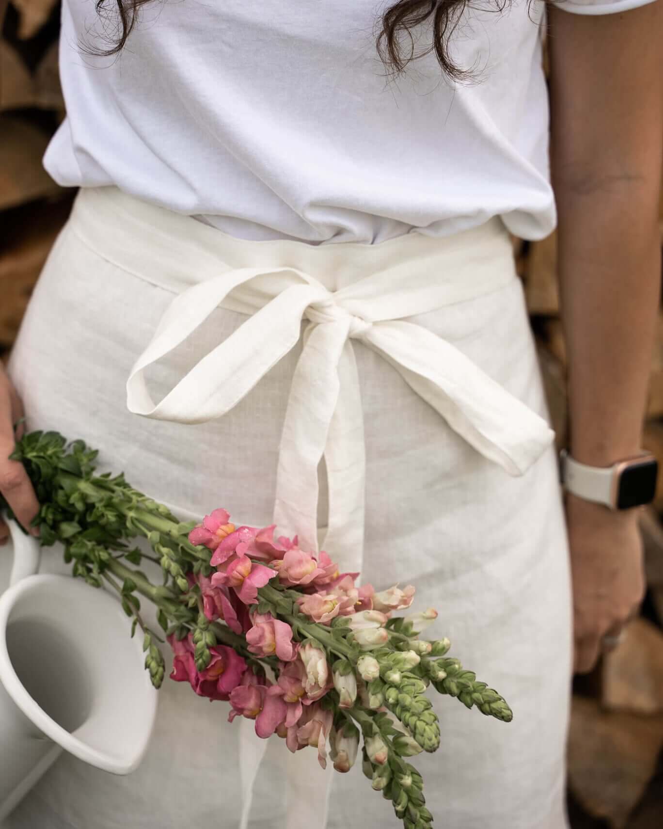 Close-up of linen half apron pocket and hem detail