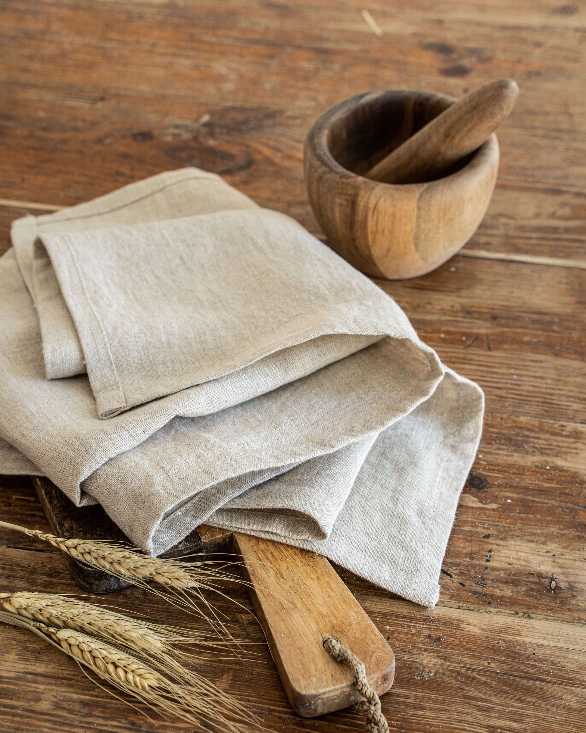 Linen tea towel styled with rustic kitchen elements