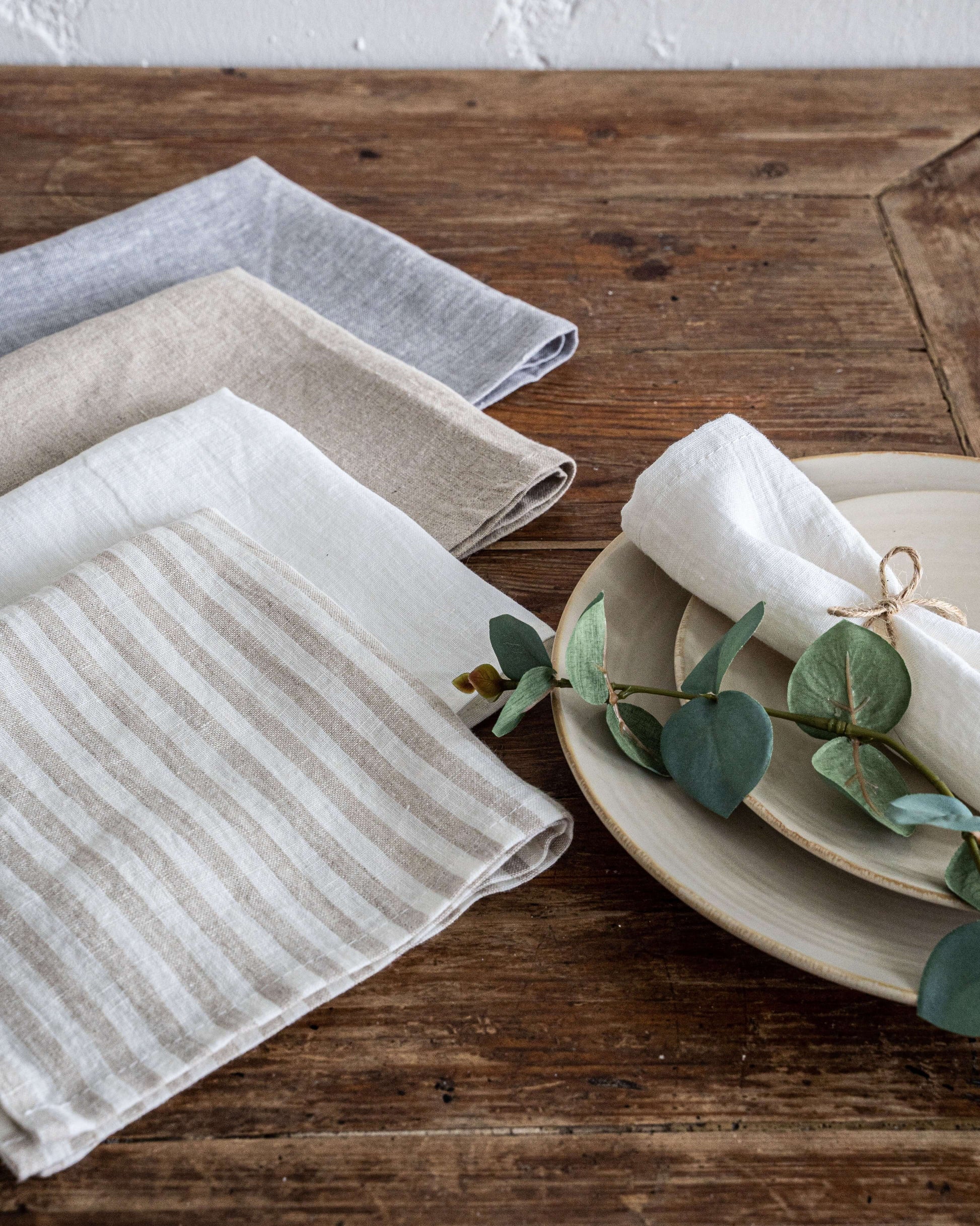 Linen napkin with green sprig decoration, festive table setting