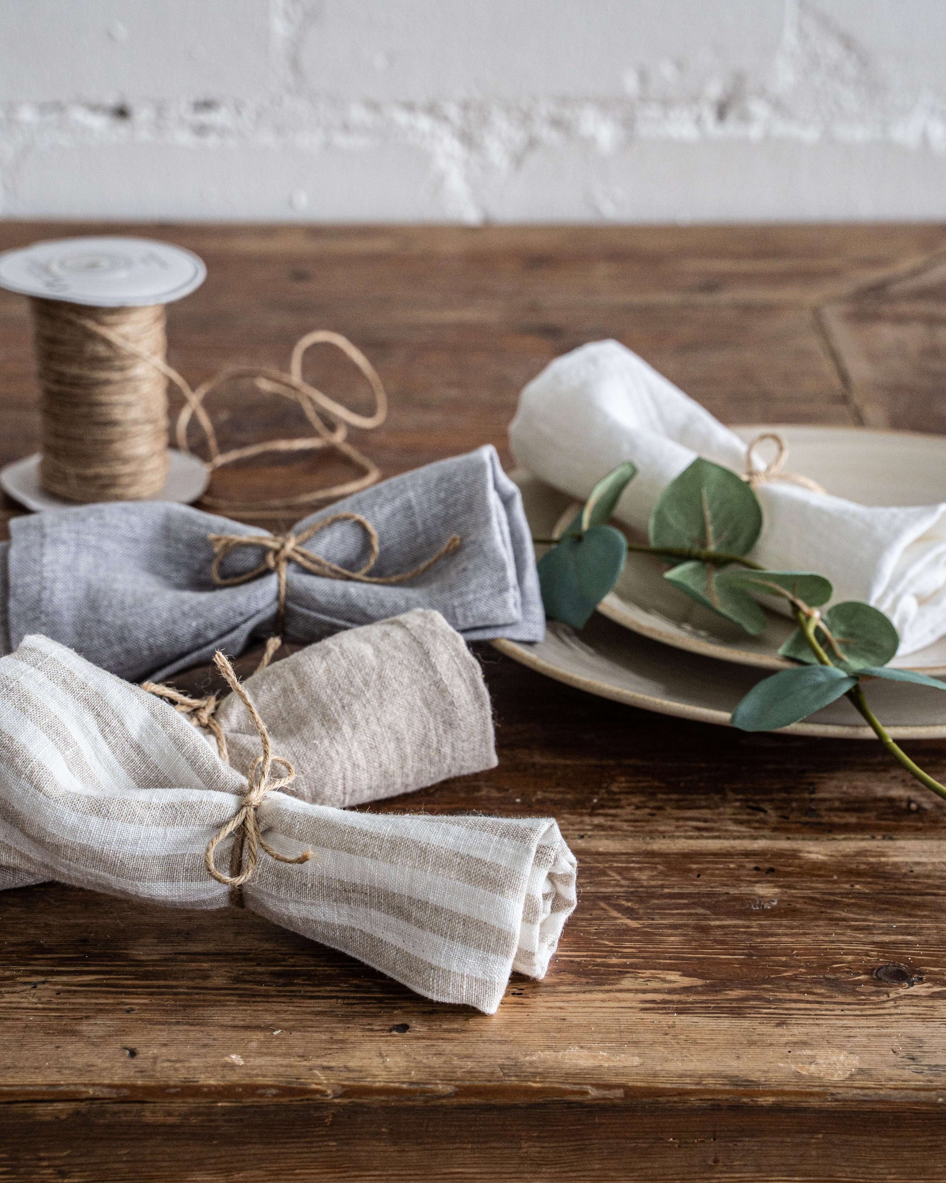 Linen napkin close-up showing hemmed edge and linen texture