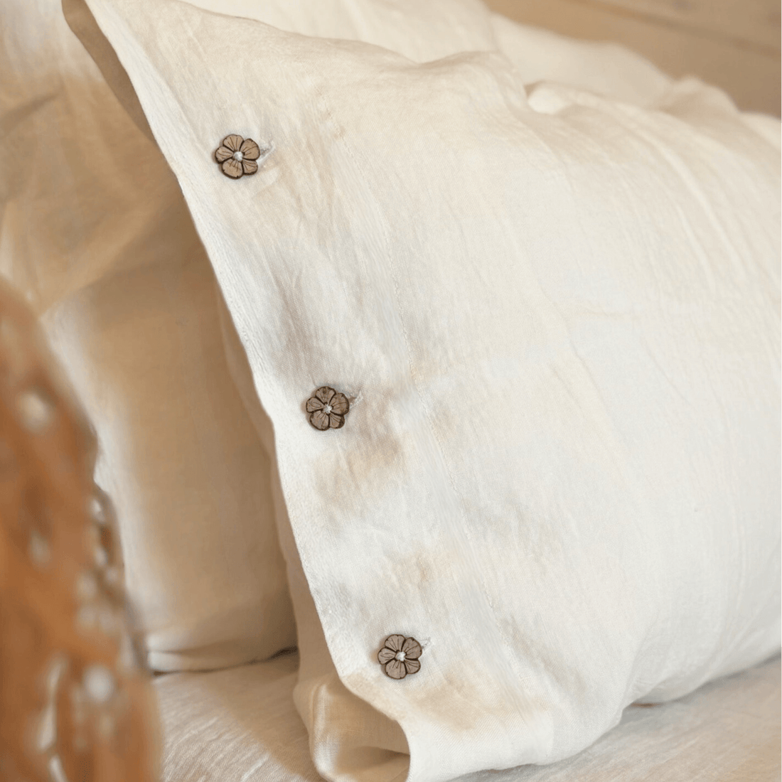 linen pillowcases corner with button closure, cream color detail