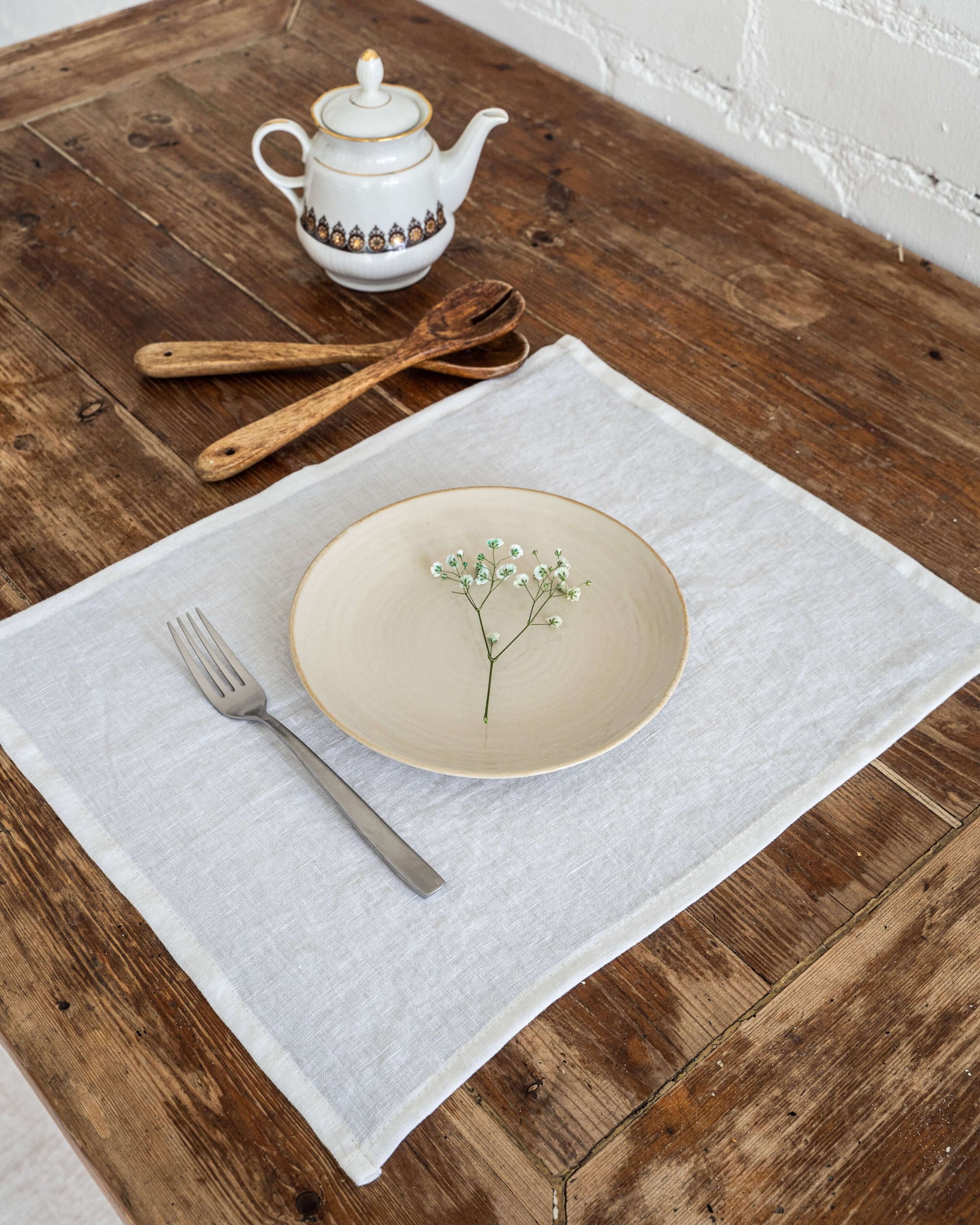 Linen placemat in striped natural on table, top view
