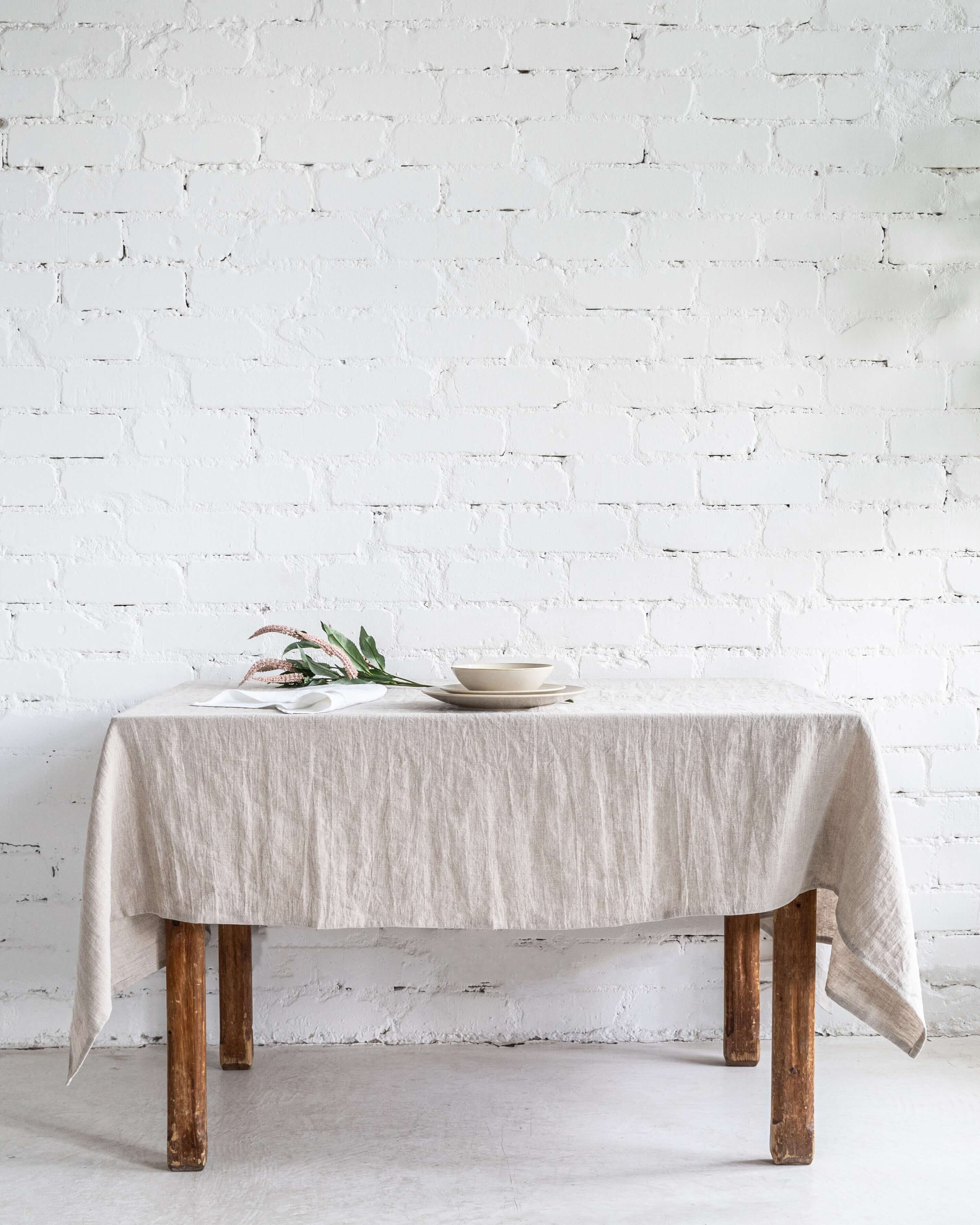 Linen tablecloth folded on table, softened linen texture close-up