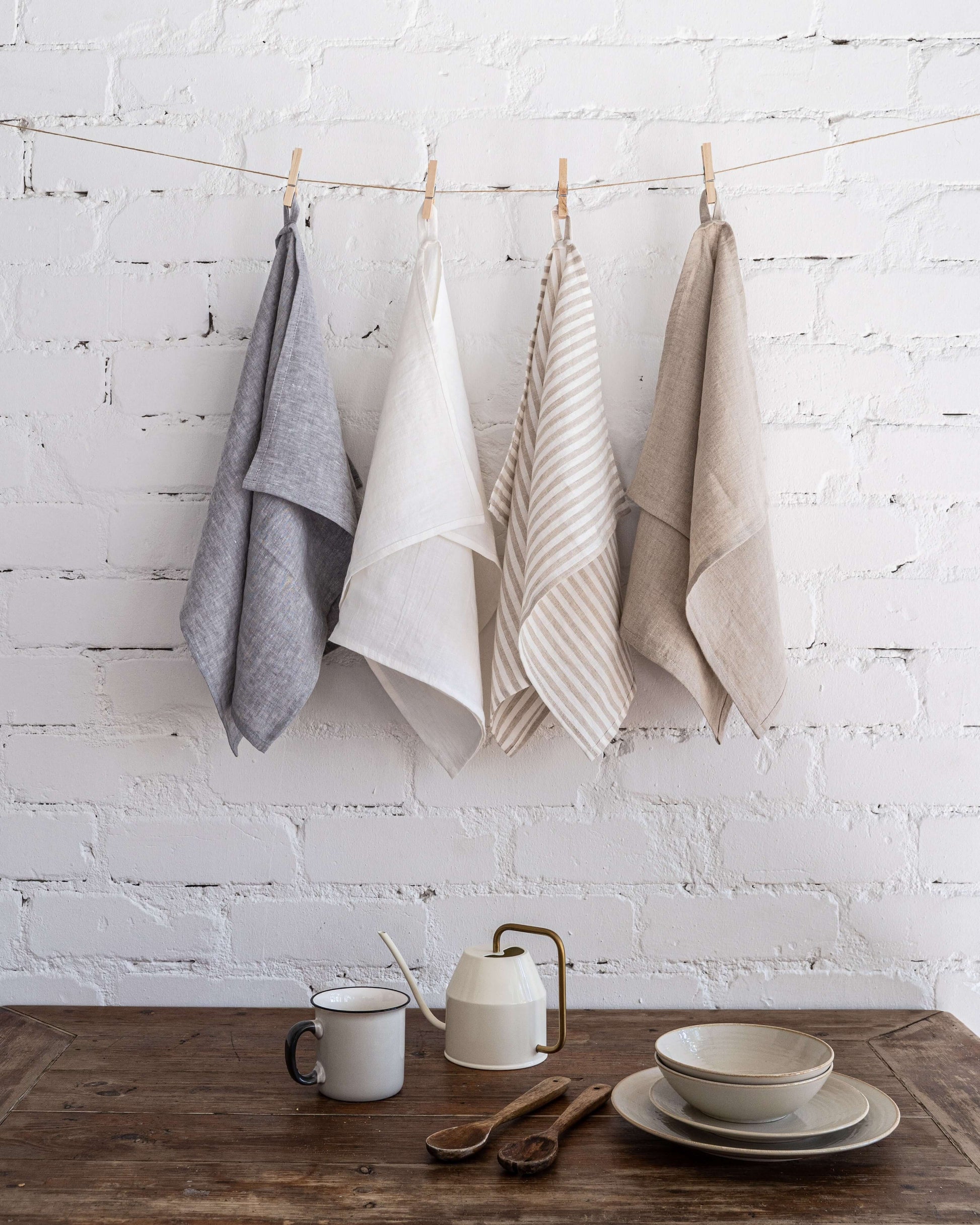 Set of 4 linen tea towels, natural tone, hung together