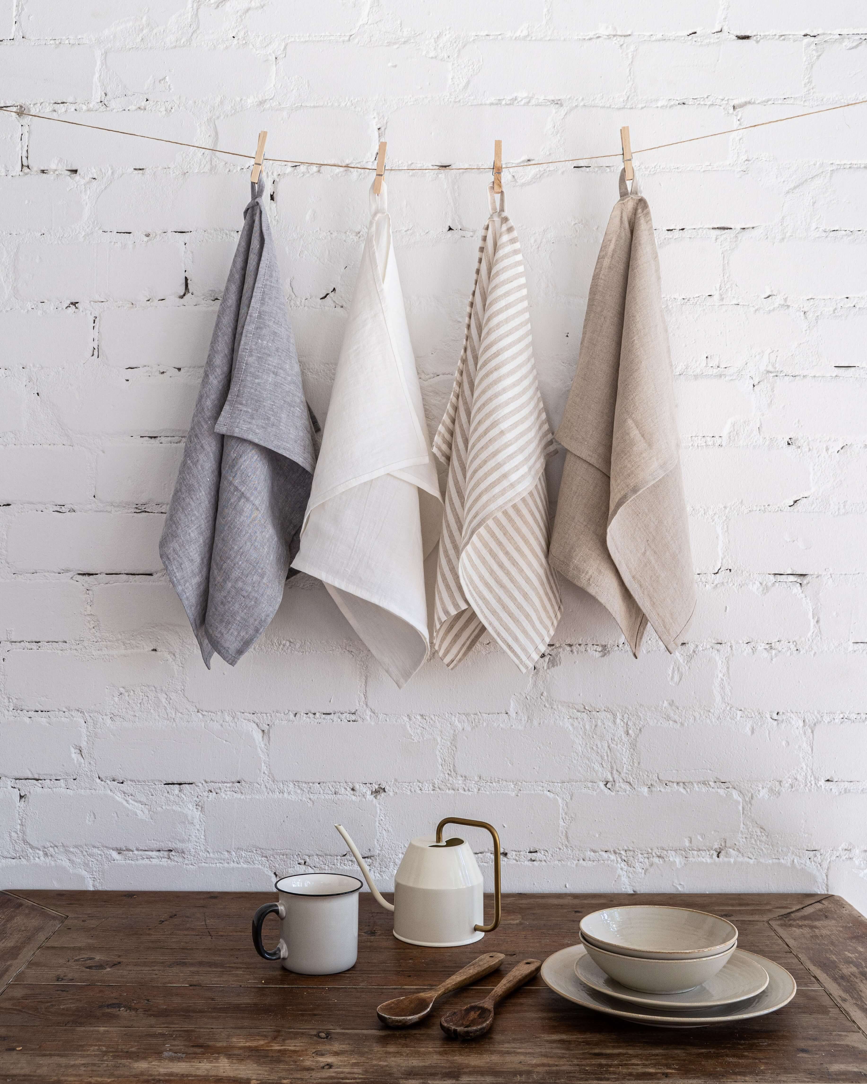 Set of 4 linen tea towels, natural tone, hung together