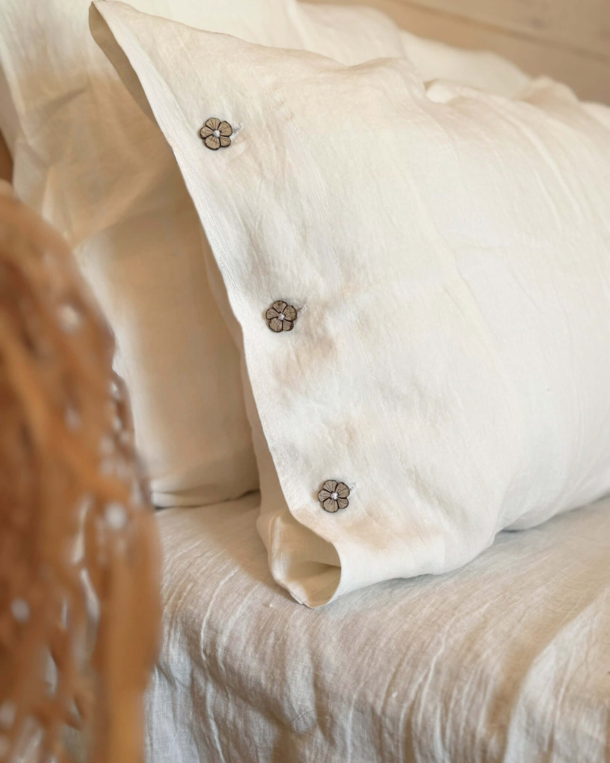 Minimalist linen bedding set styled on bed, neutral and calming bedroom