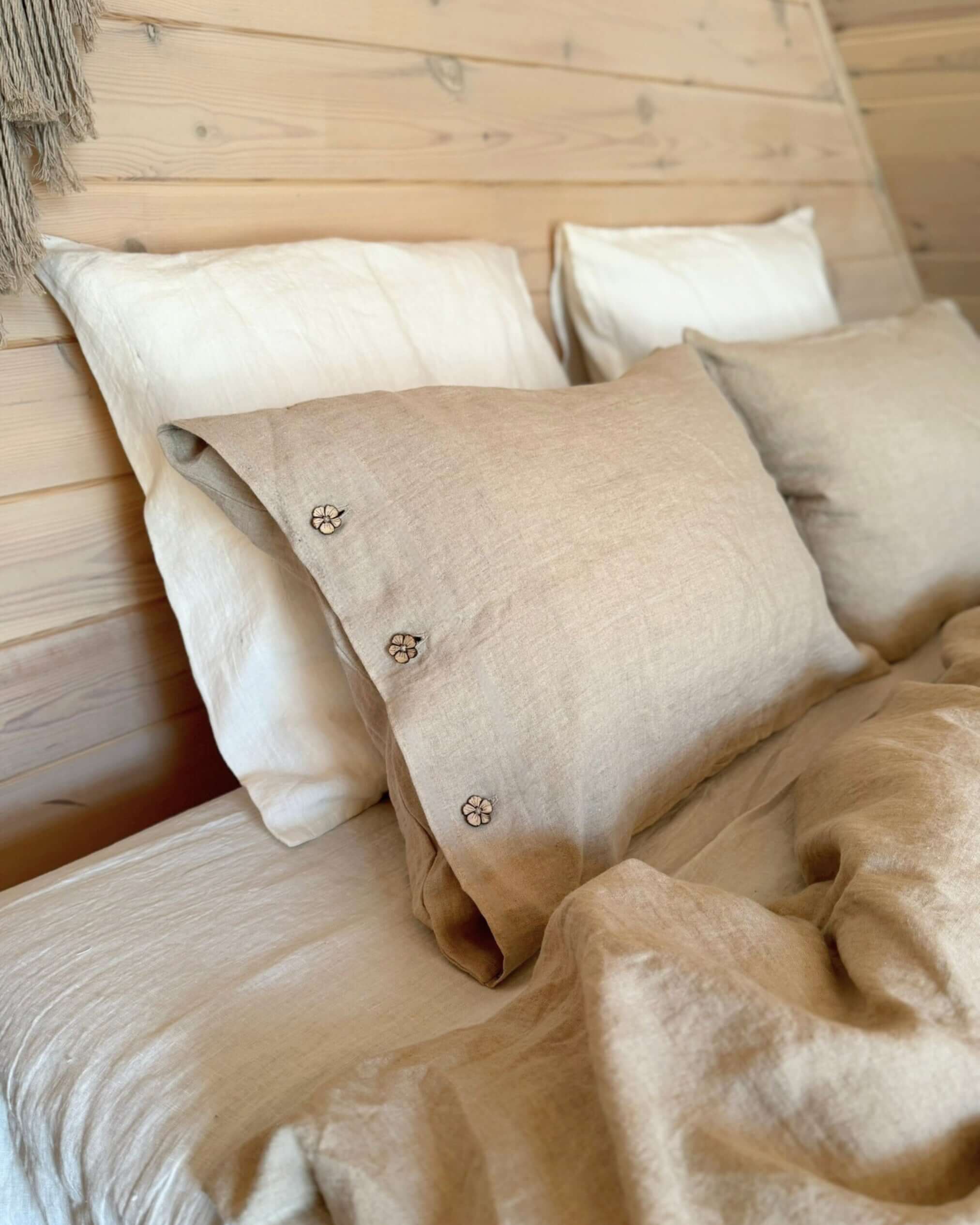 Minimalist linen bedding set on bed, lifestyle photo with soft morning light
