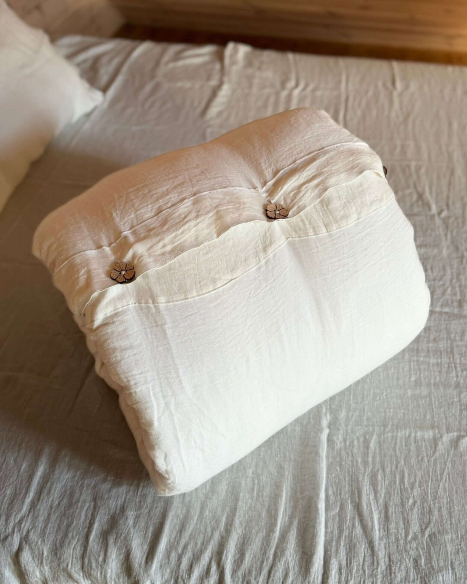 Minimalist linen duvet cover styled on bed, neutral bedroom setting