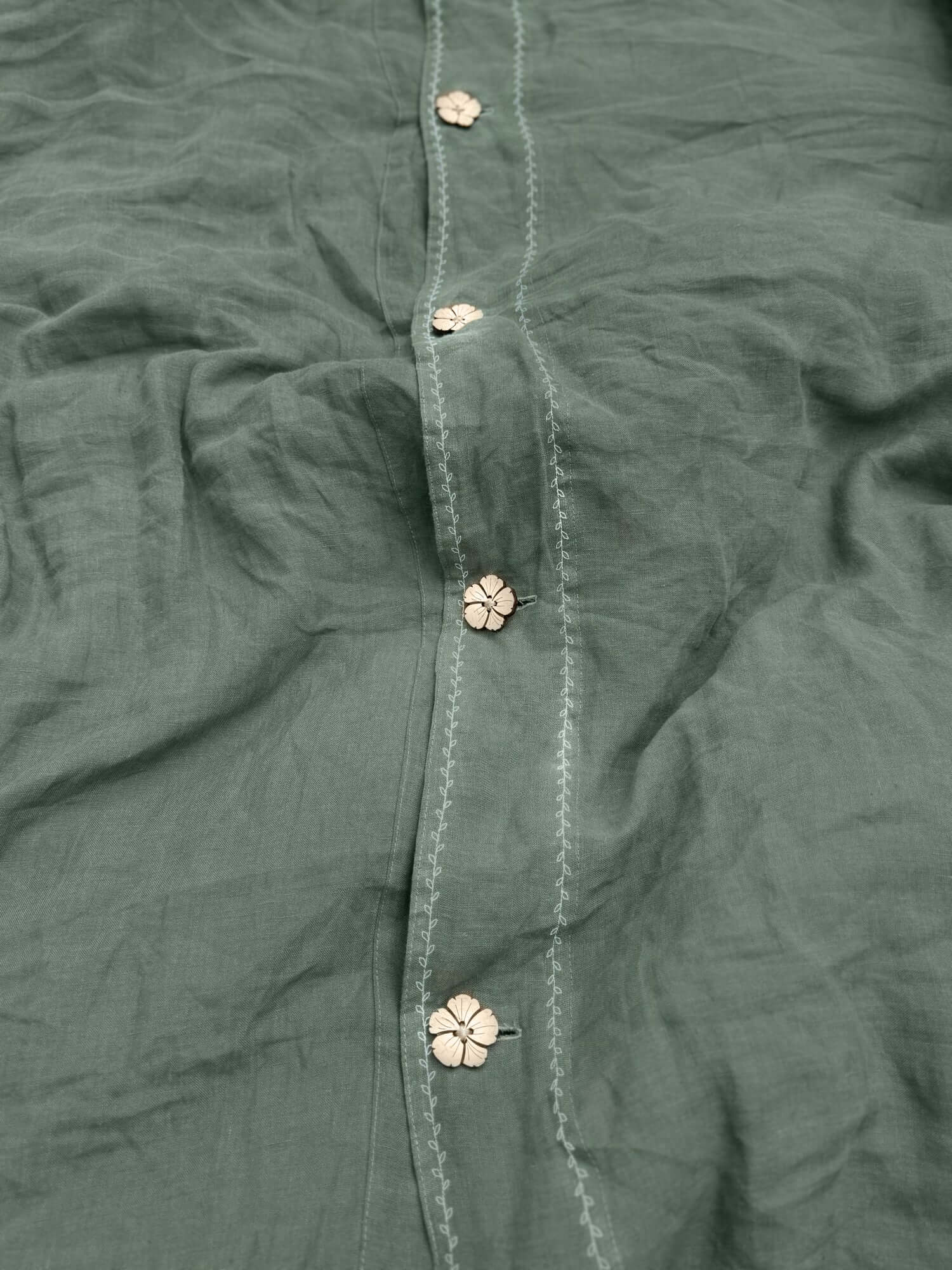 White embroidered linen bedding set styled on bed, EU, UK, US size