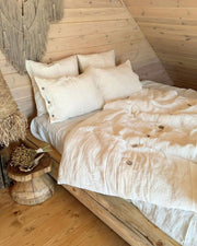 Linen duvet cover in off white on white bed, lifestyle bedroom photo
