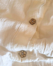 Close-up of top closure mechanism on minimalist linen duvet cover