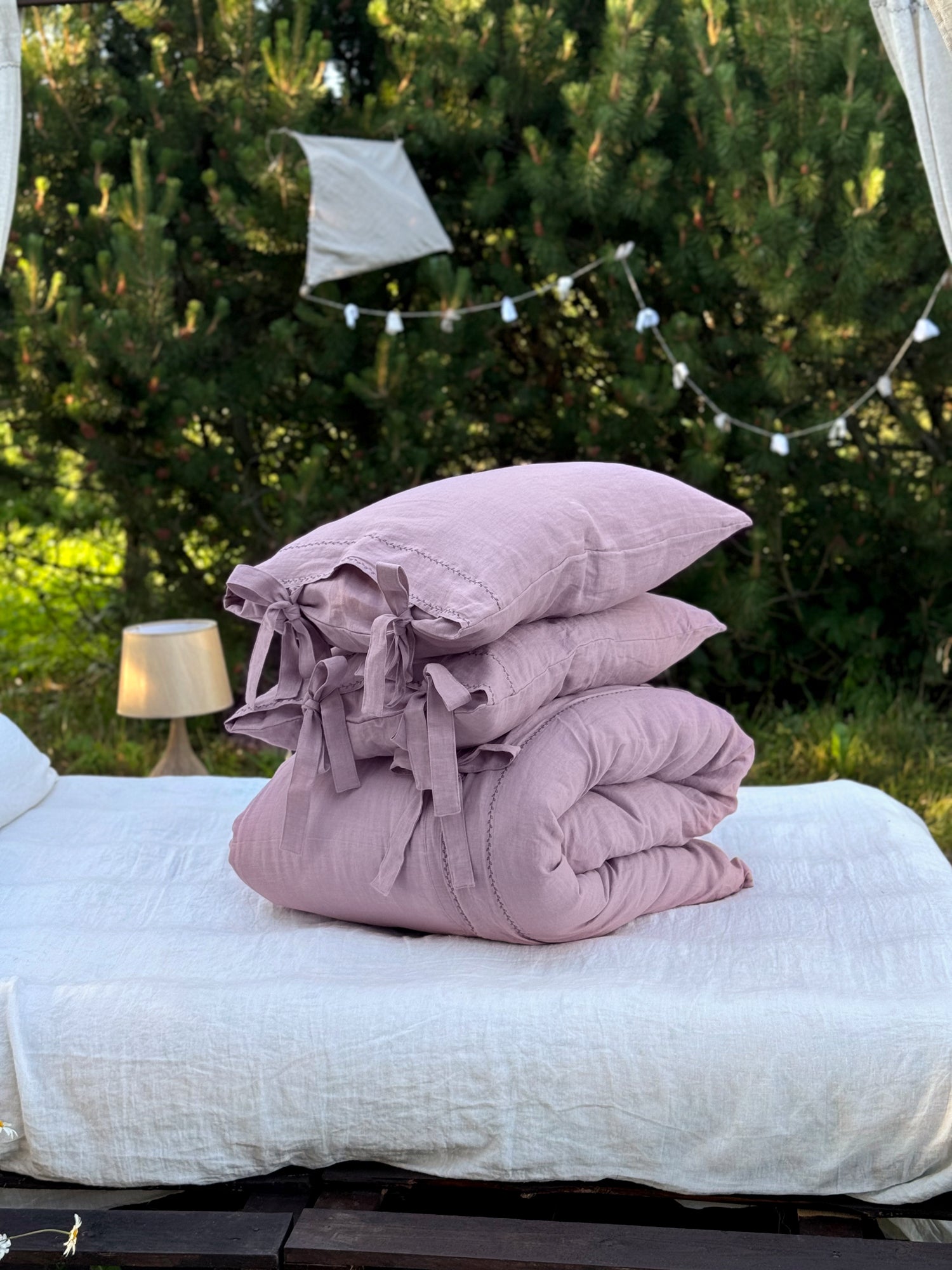 Black embroidered linen bedding set, top closure button detail