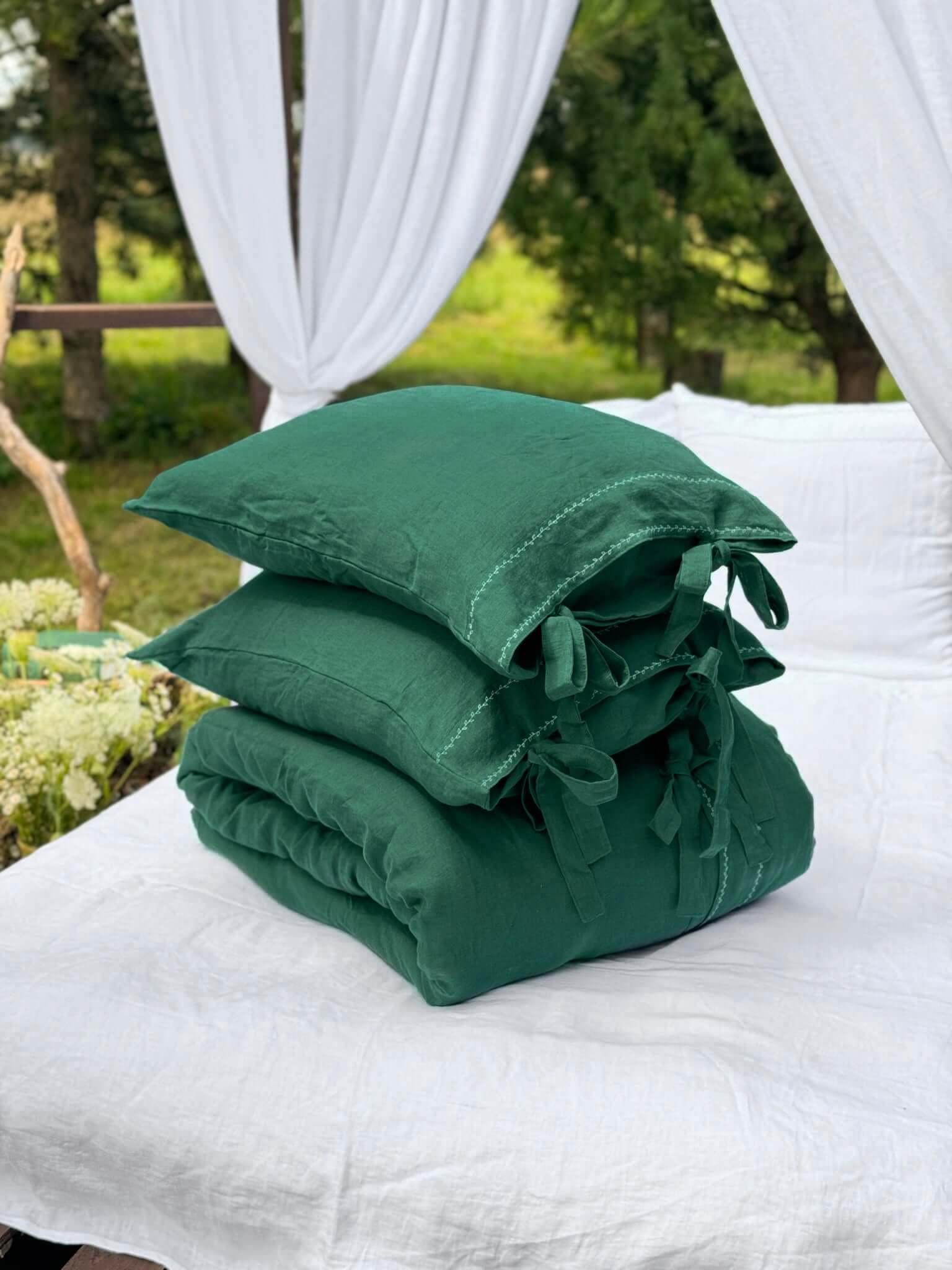 White embroidered linen bedding set close-up, embroidery detail
