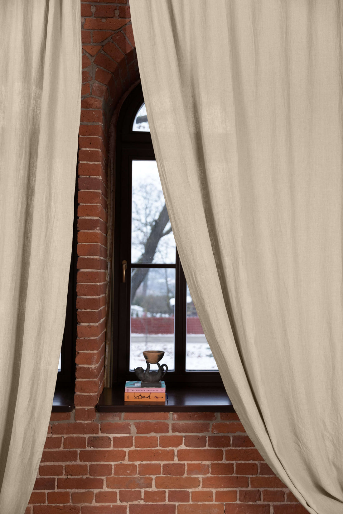 Natural linen curtain panel, 190 g/m², styled in a warm interior