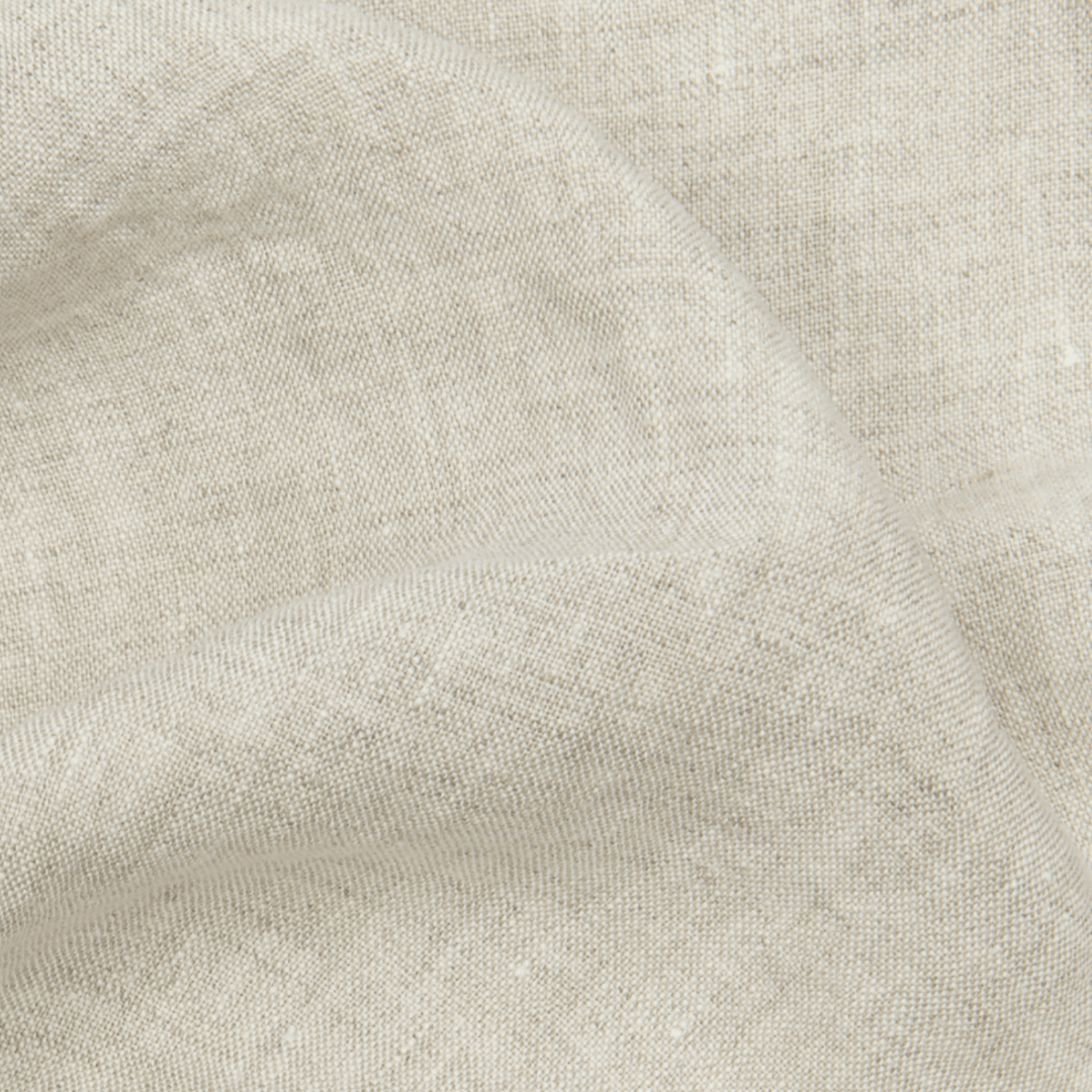 Cream linen fabric swatch close-up, softened texture detail