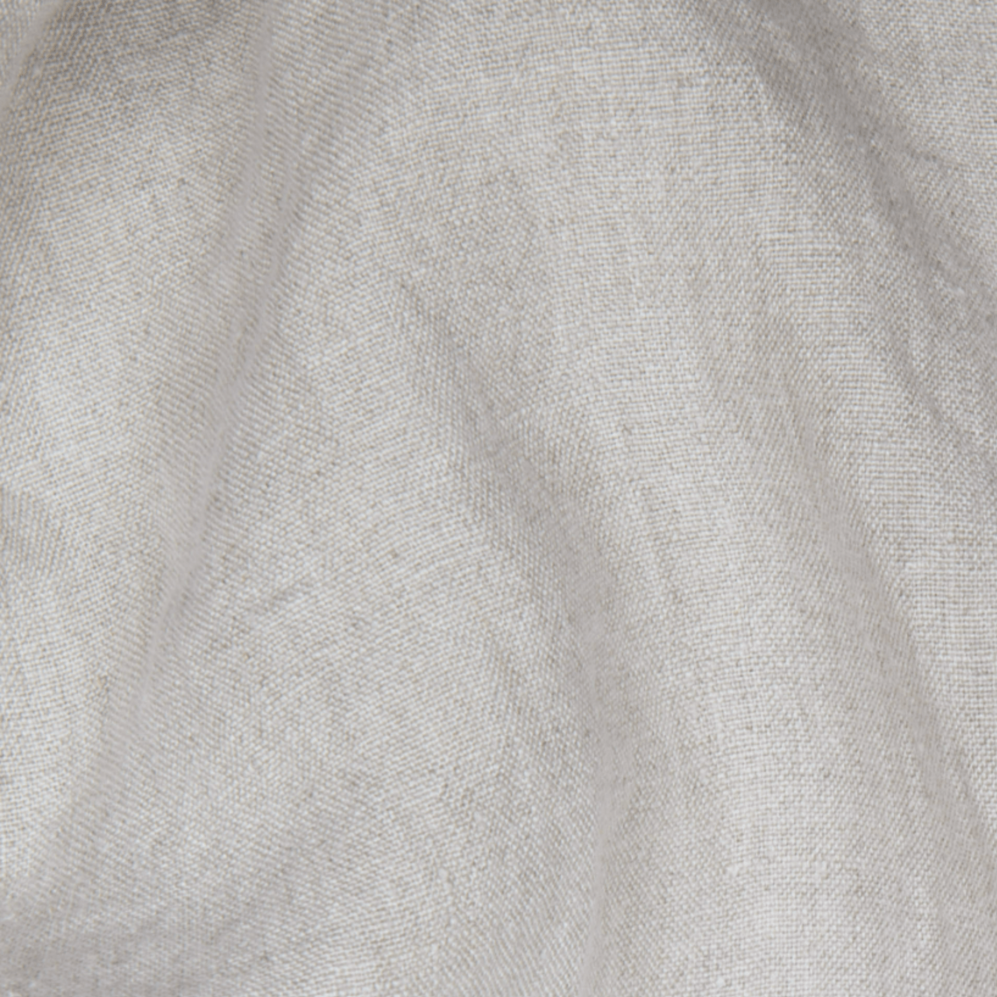 Close-up of natural linen fabric texture with soft wrinkles