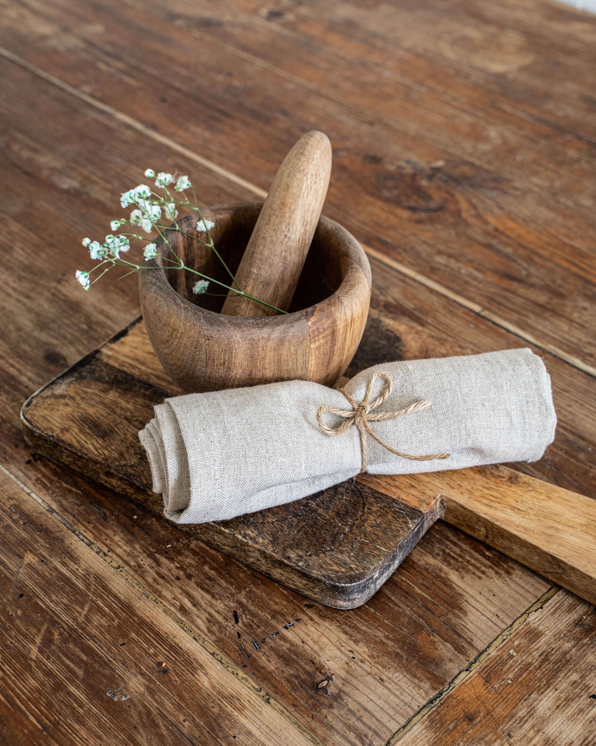 Linen napkin in natural tone draped on plate, restaurant style
