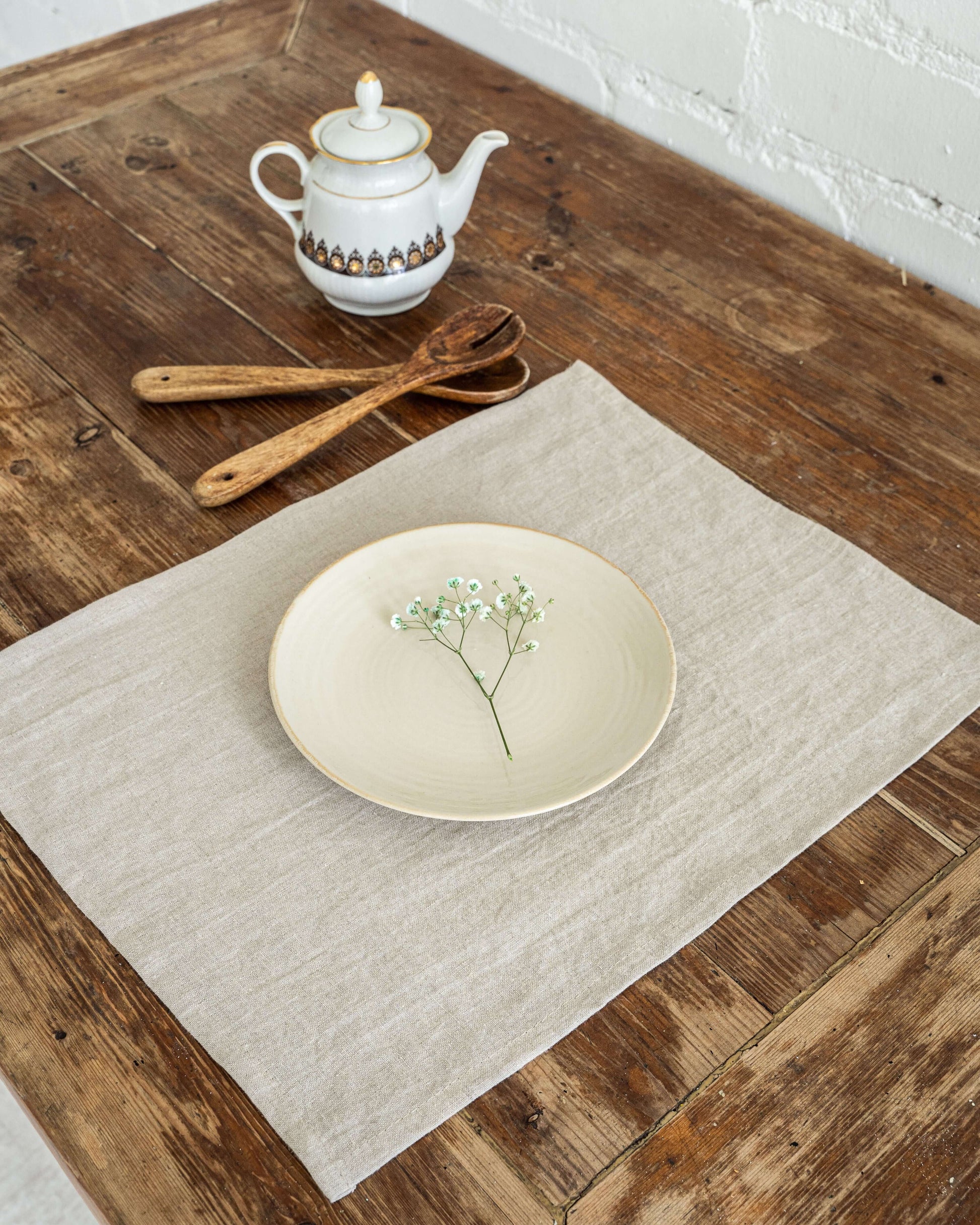 Linen placemat close-up, hemmed edge and fabric detail