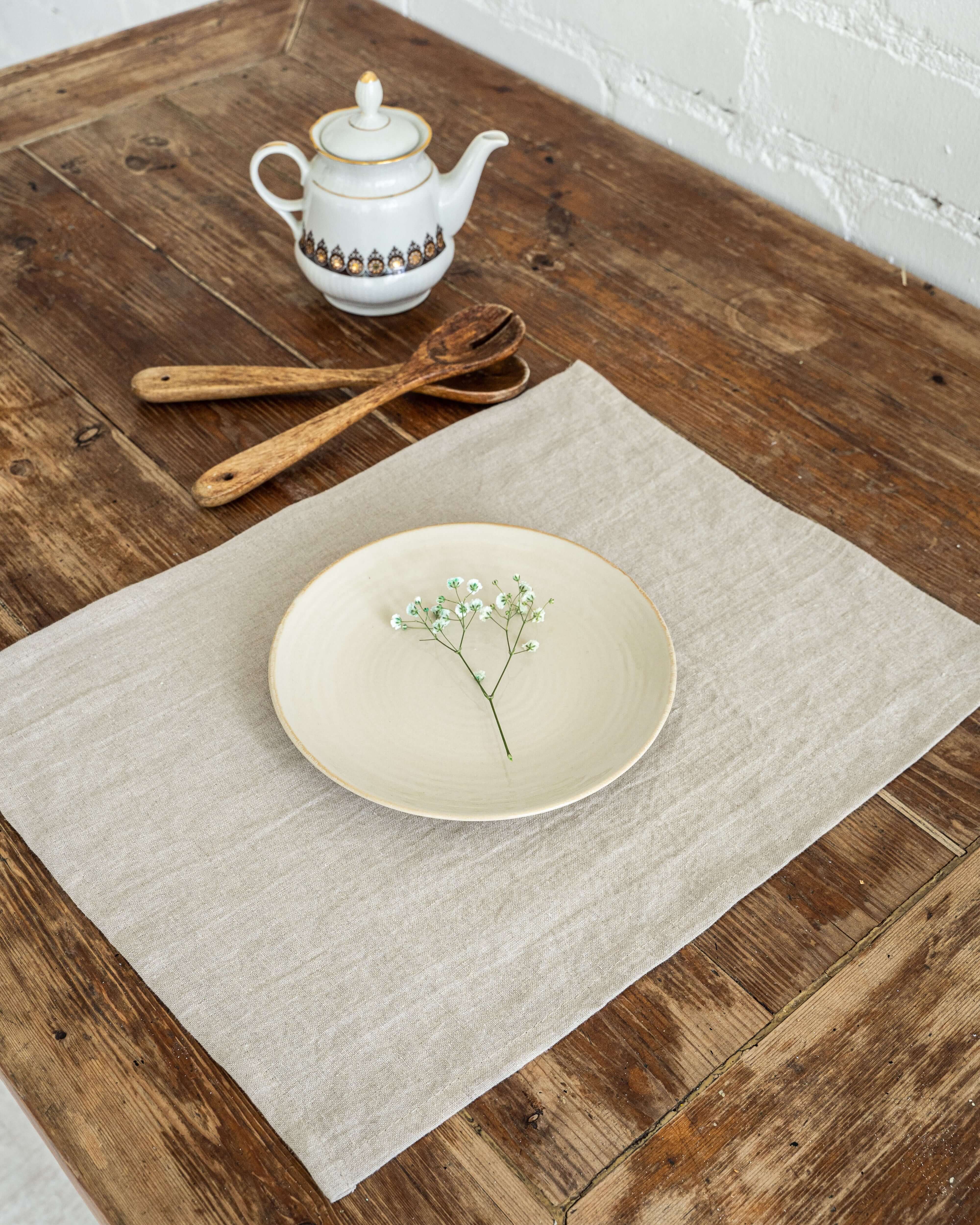 Linen placemat close-up, hemmed edge and fabric detail