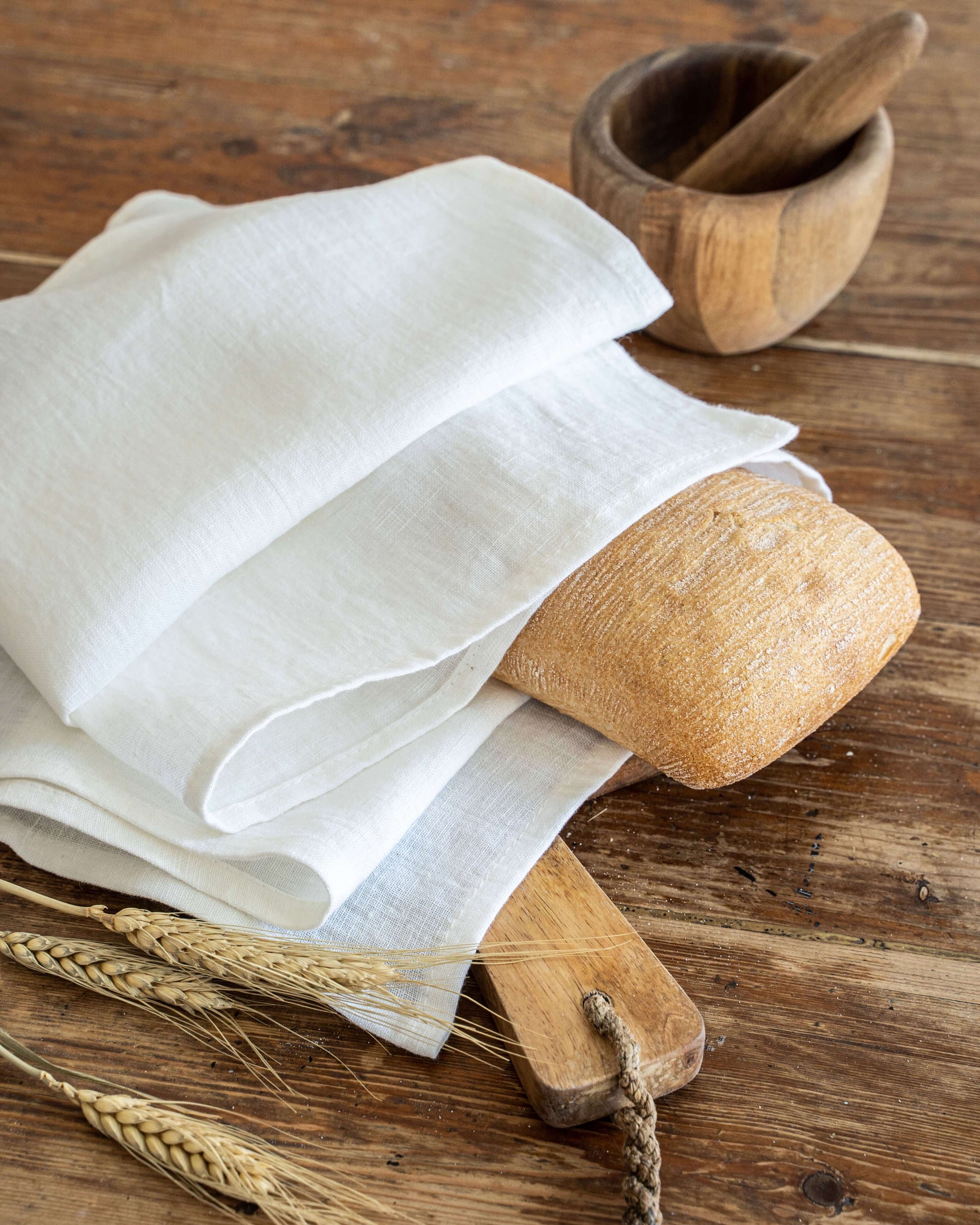 Linen tea towel close-up showing hemmed edge and weave detail
