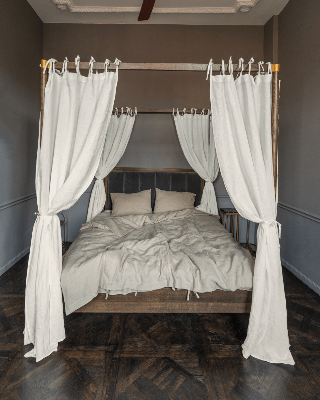 Off white tie-top linen canopy curtains on four-poster bed, front view