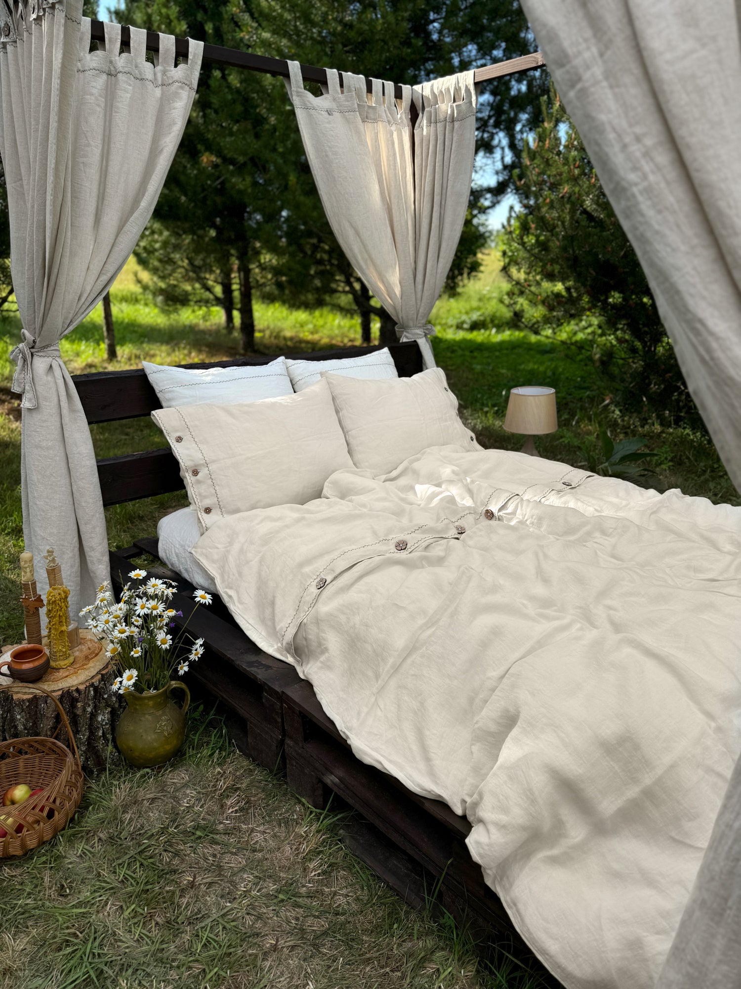 Black embroidered linen duvet cover close-up, contrast embroidery on softened linen