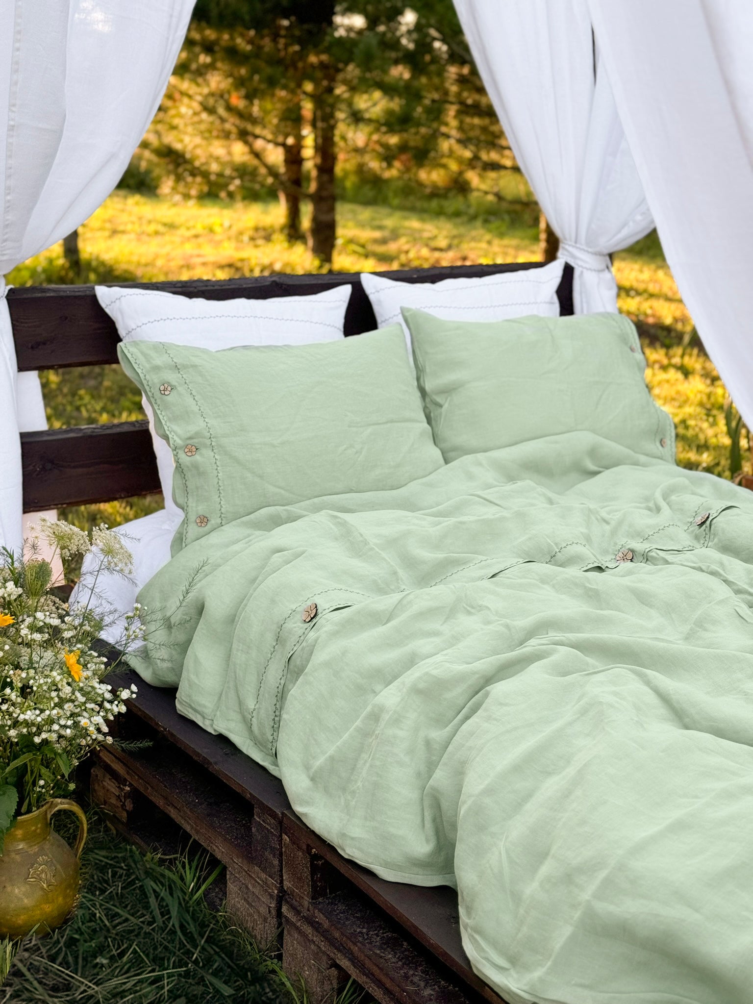 Black embroidered linen bedding set, full bed view with neutral styling