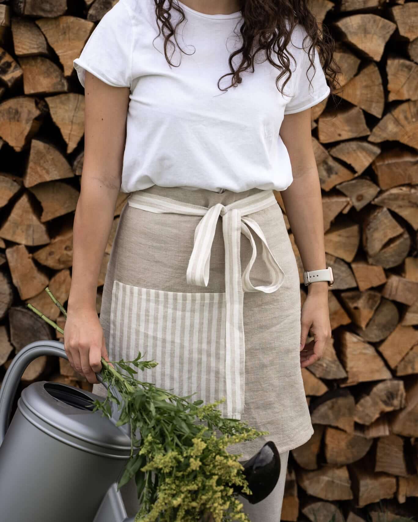 Linen half apron tied at waist with decorative bow
