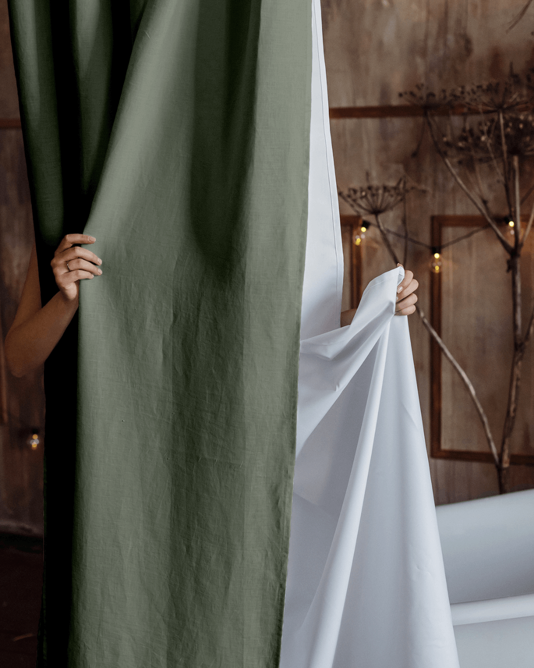 Safari green linen shower curtain in rustic bathroom with bathtub
