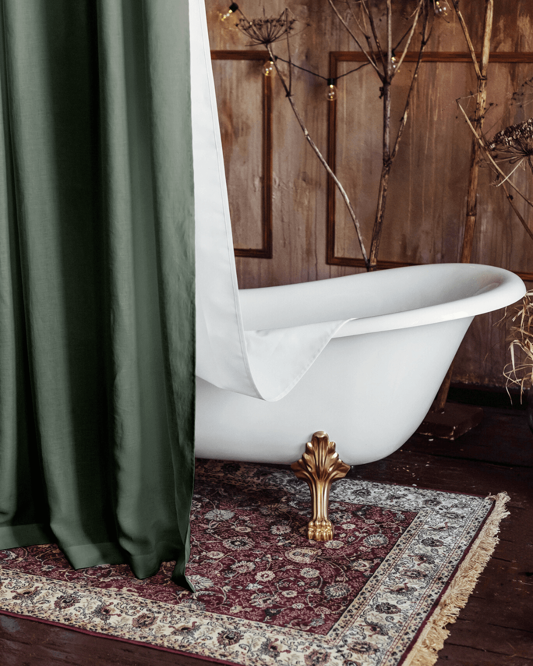 Green shower curtain in styled bathroom interior