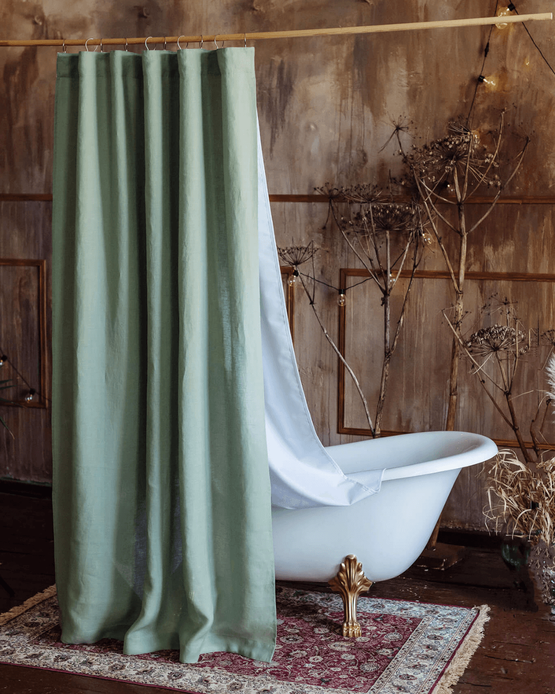 Sage green linen fabric shower curtain in styled bathroom interior
