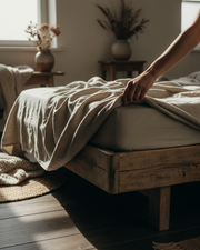 Linen flat sheet with no middle seam on bed, natural tone, top view
