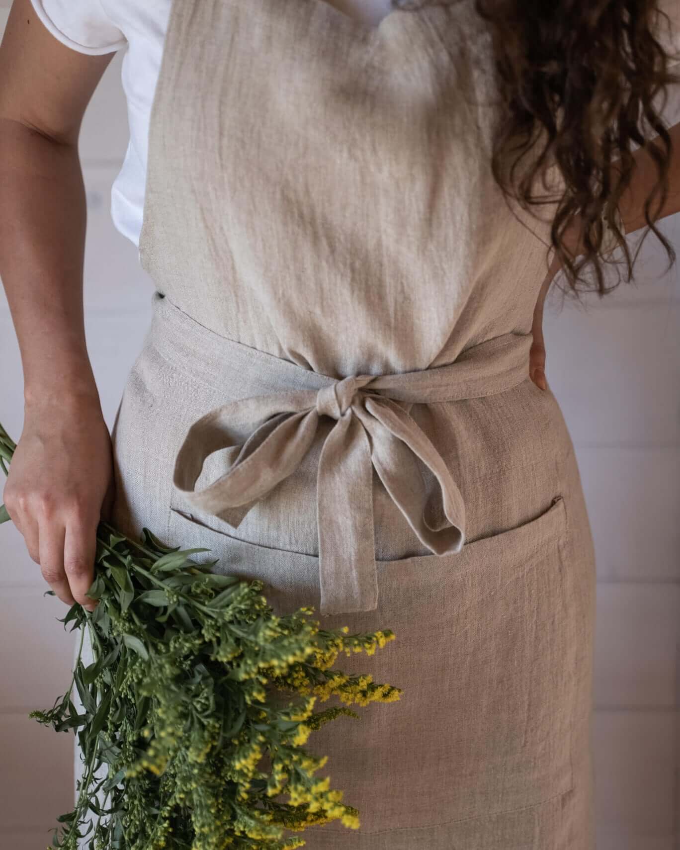 Linen apron waist tie and pocket close-up