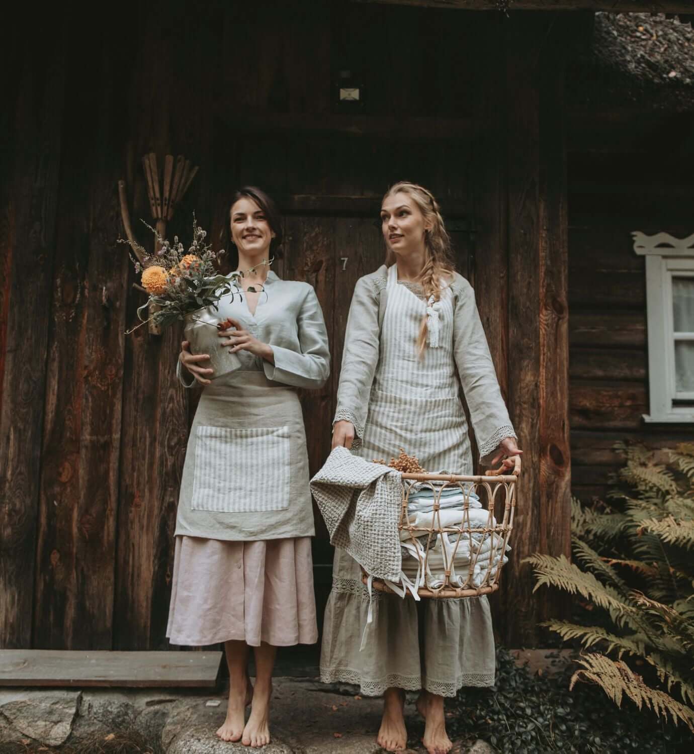 Two women wearing linen outfits in a European linen brand lifestyle photo