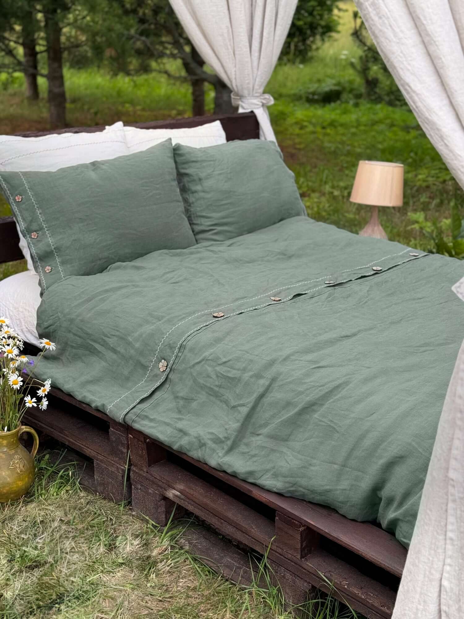 White embroidered linen bedding set, full bed view with neutral styling