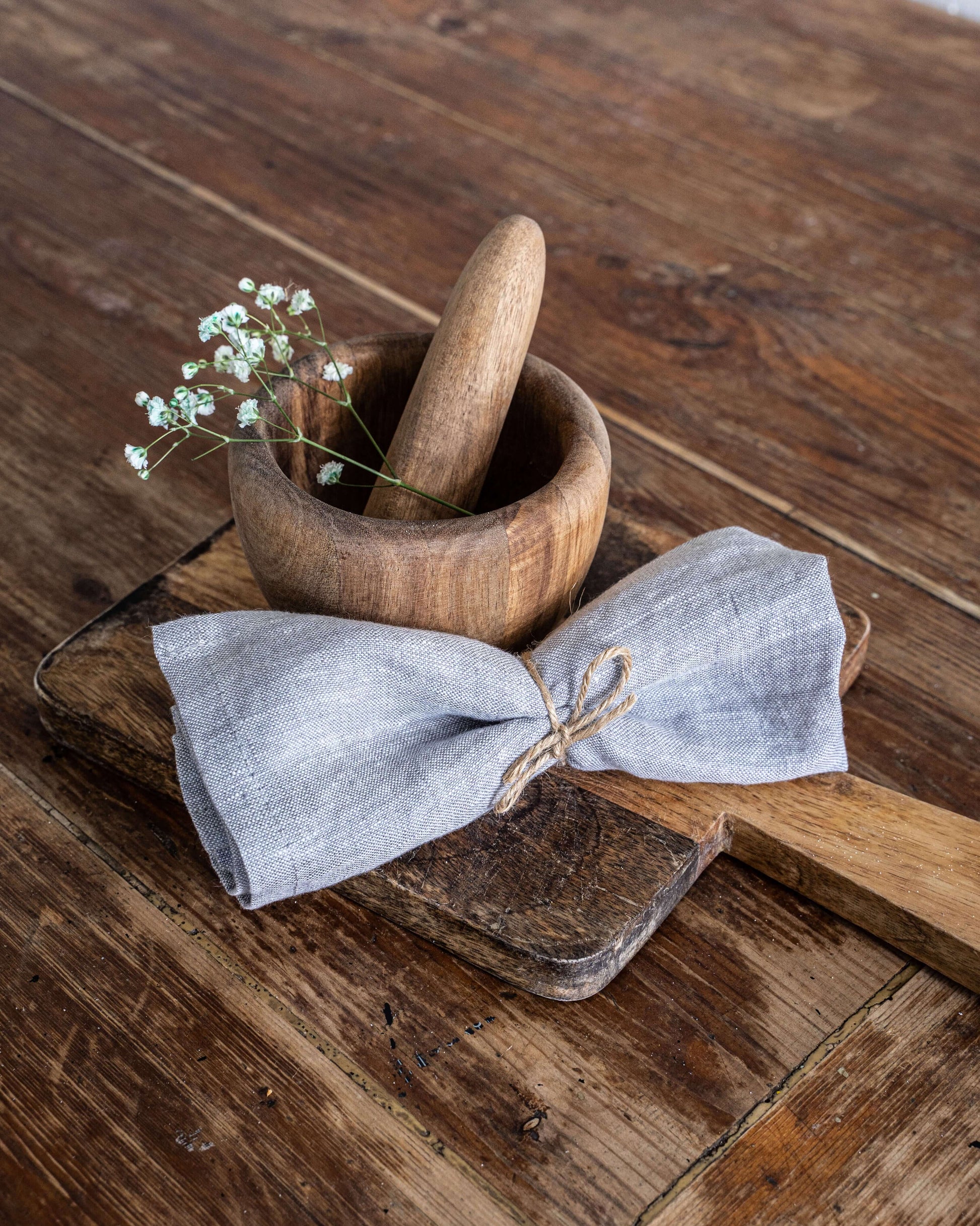Folded linen napkin with soft texture on a rustic wooden table
