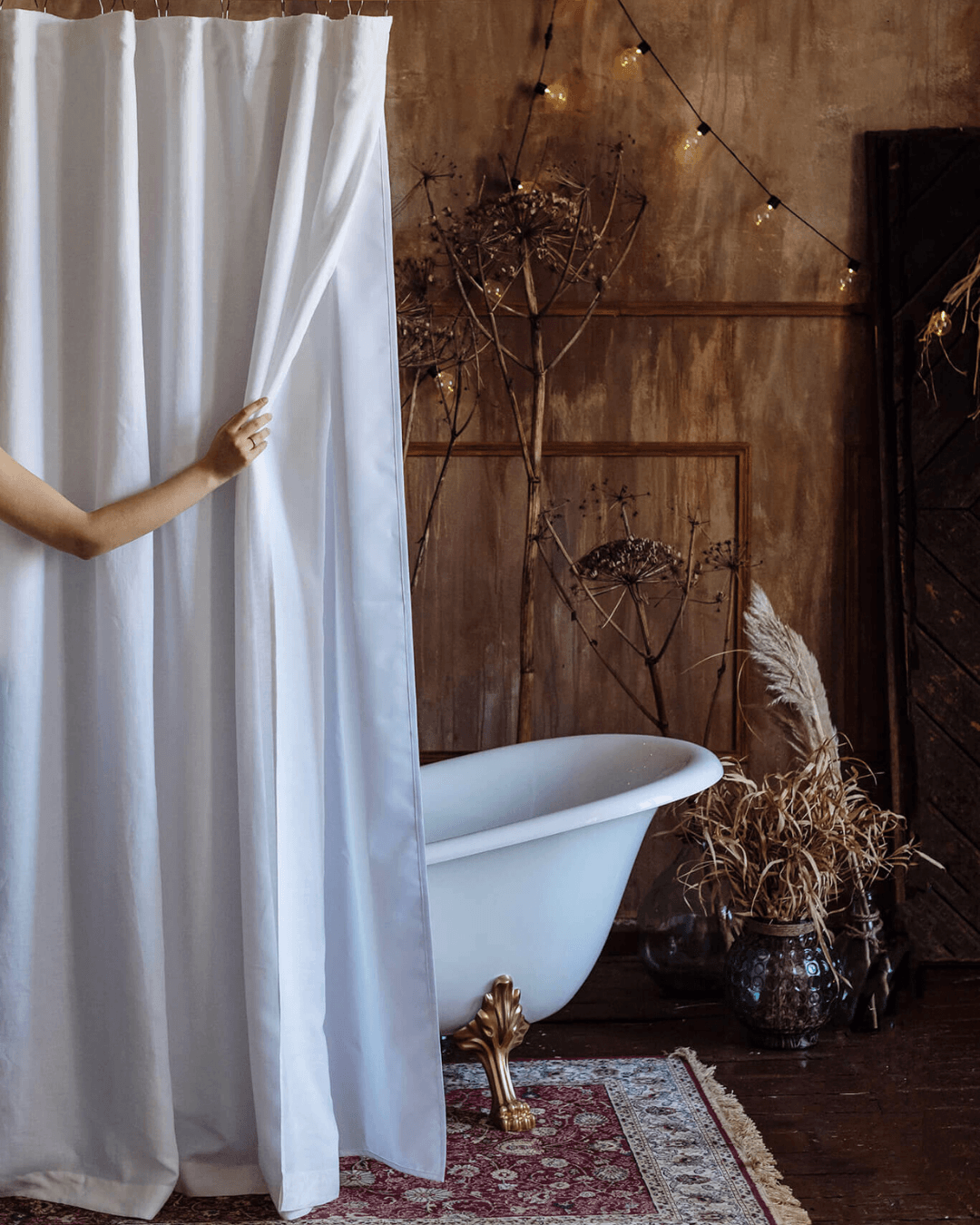 White shower curtain with lining in rustic bathroom interior