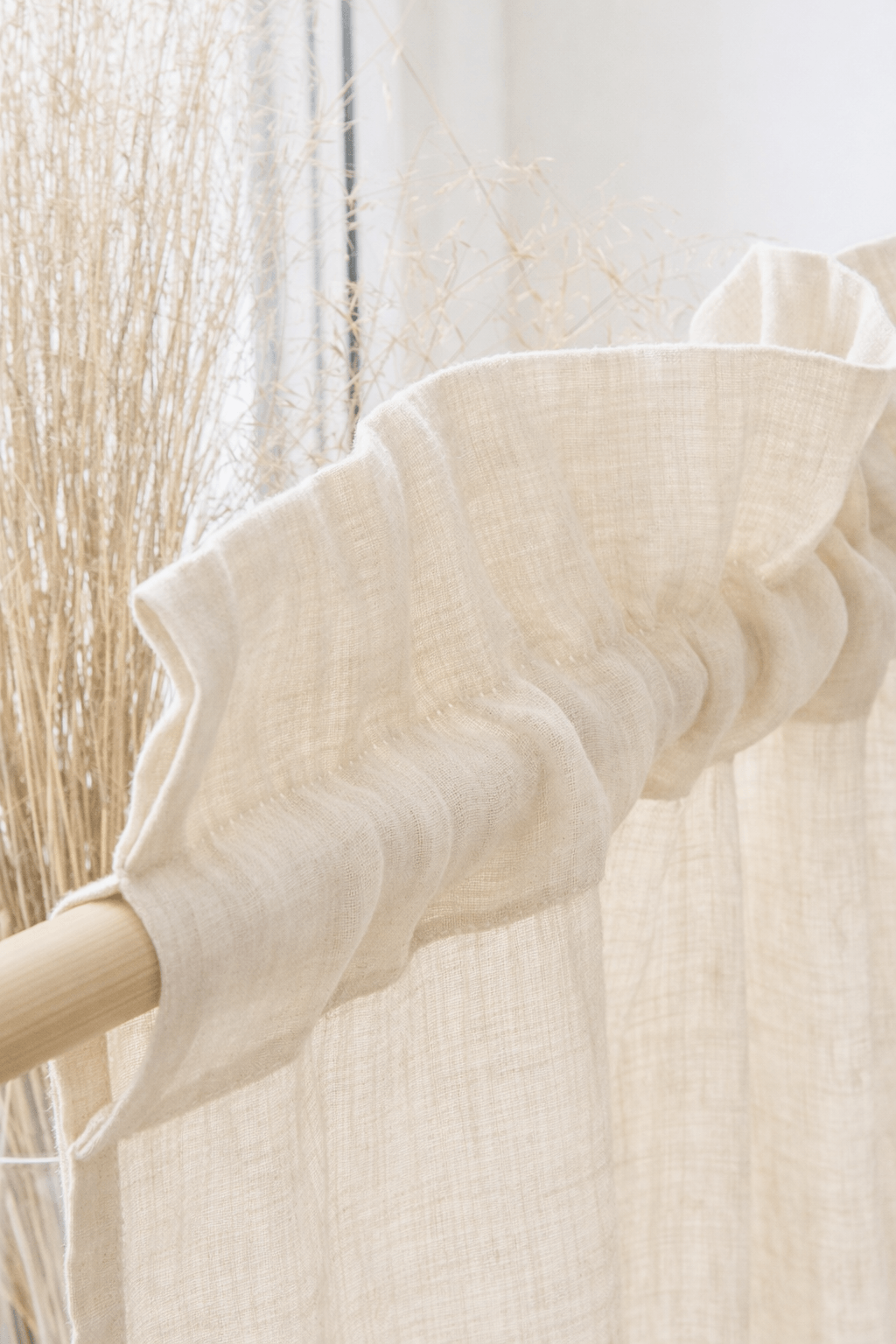 White textured linen curtain with crowned rod pocket edge detail