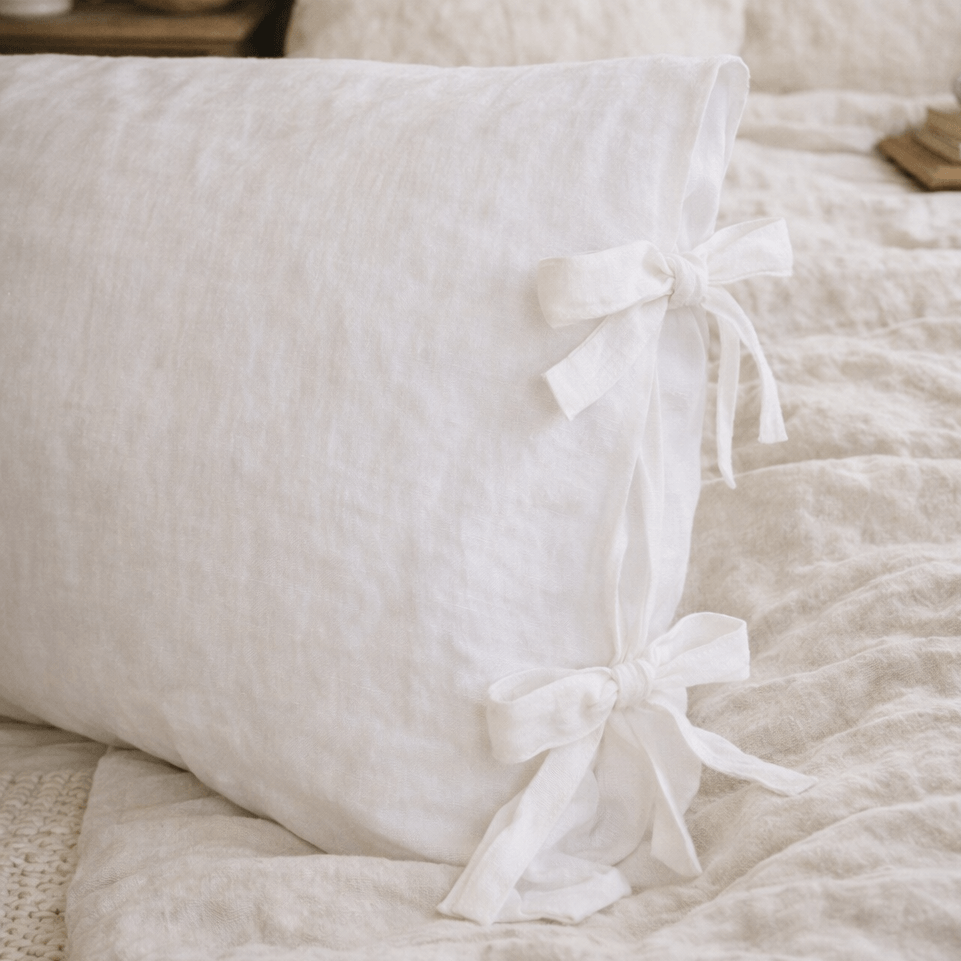 White linen pillowcases with Ribbon ties close-up, ruffled texture detail