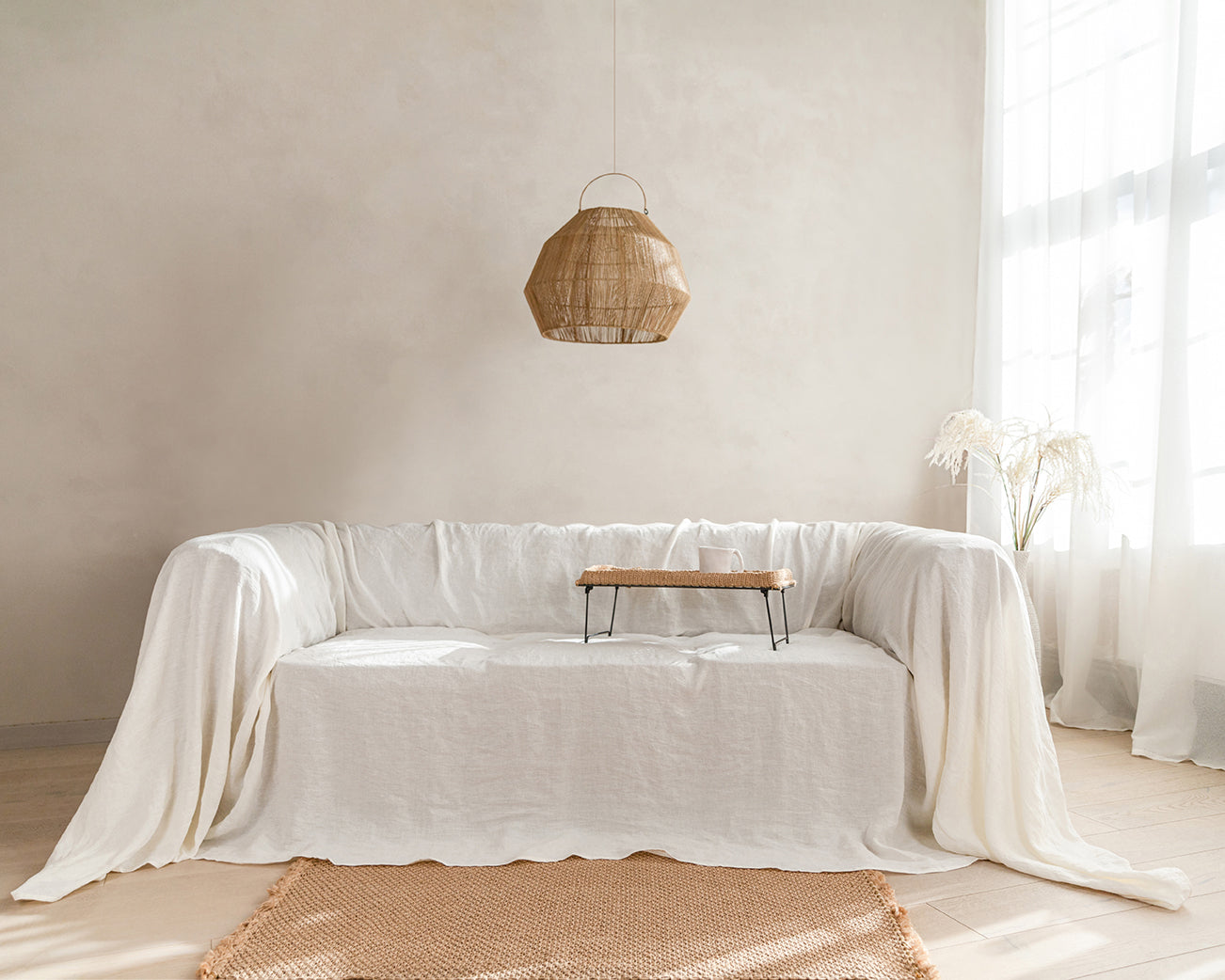 a living room with a white couch and a table