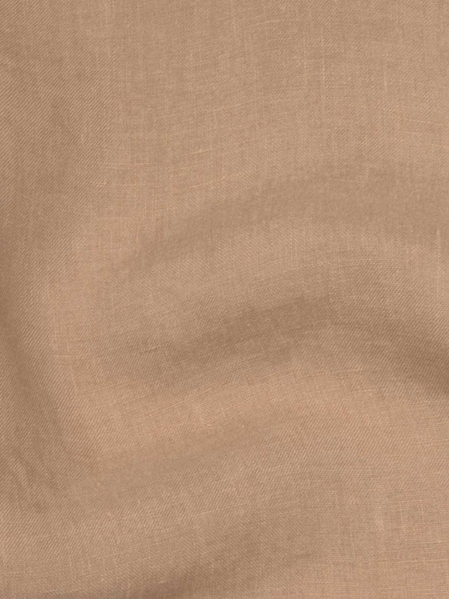 a tan fabric with a white background