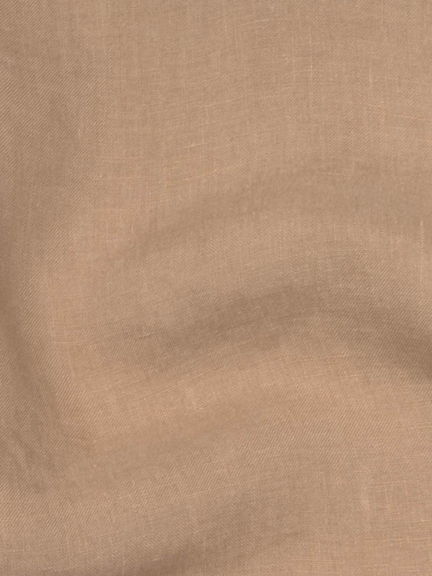 a tan fabric with a white background