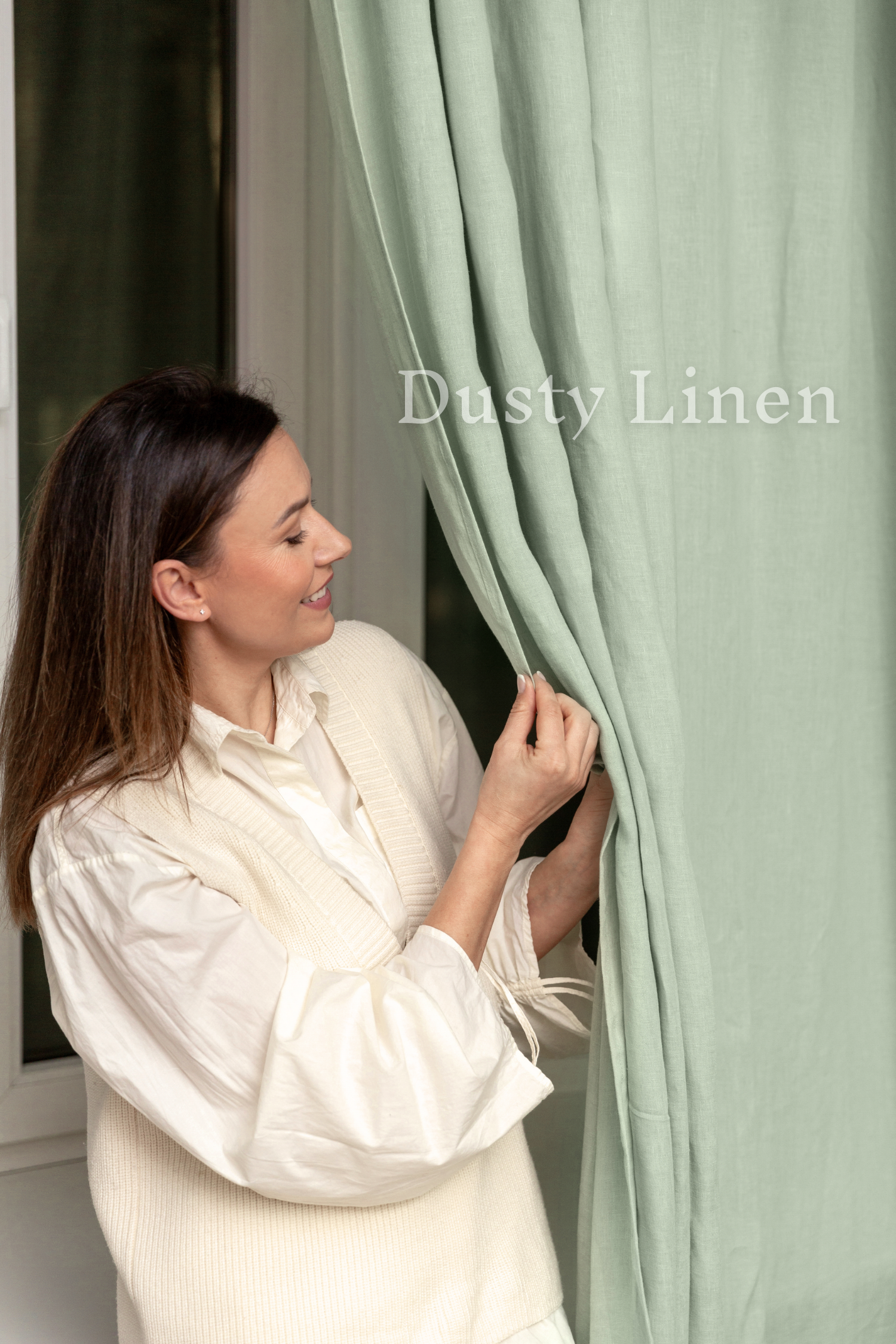 a woman opening a curtain with her hands