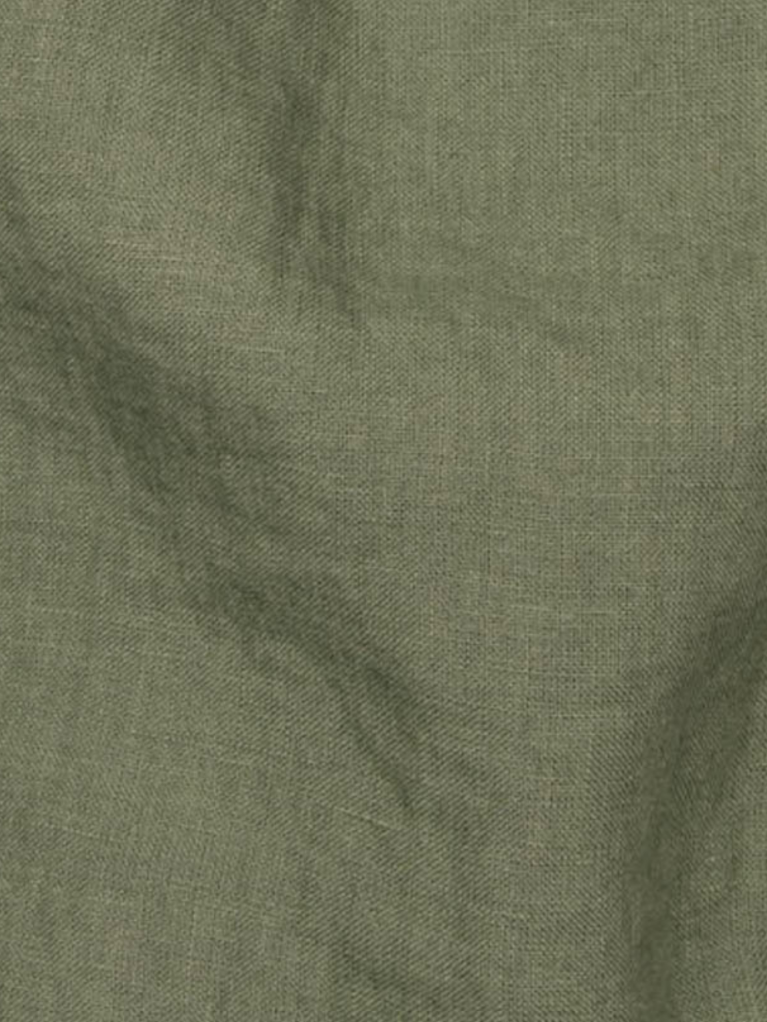 a close up view of a green fabric