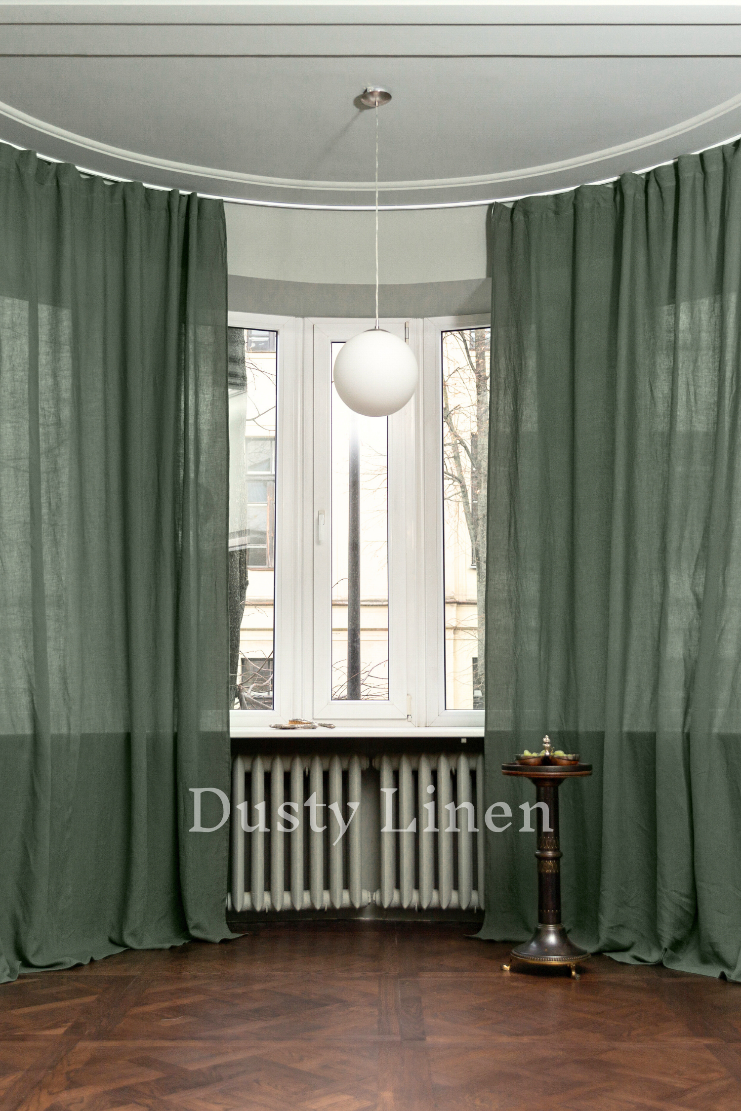 a room with a radiator, a radiator, and a window